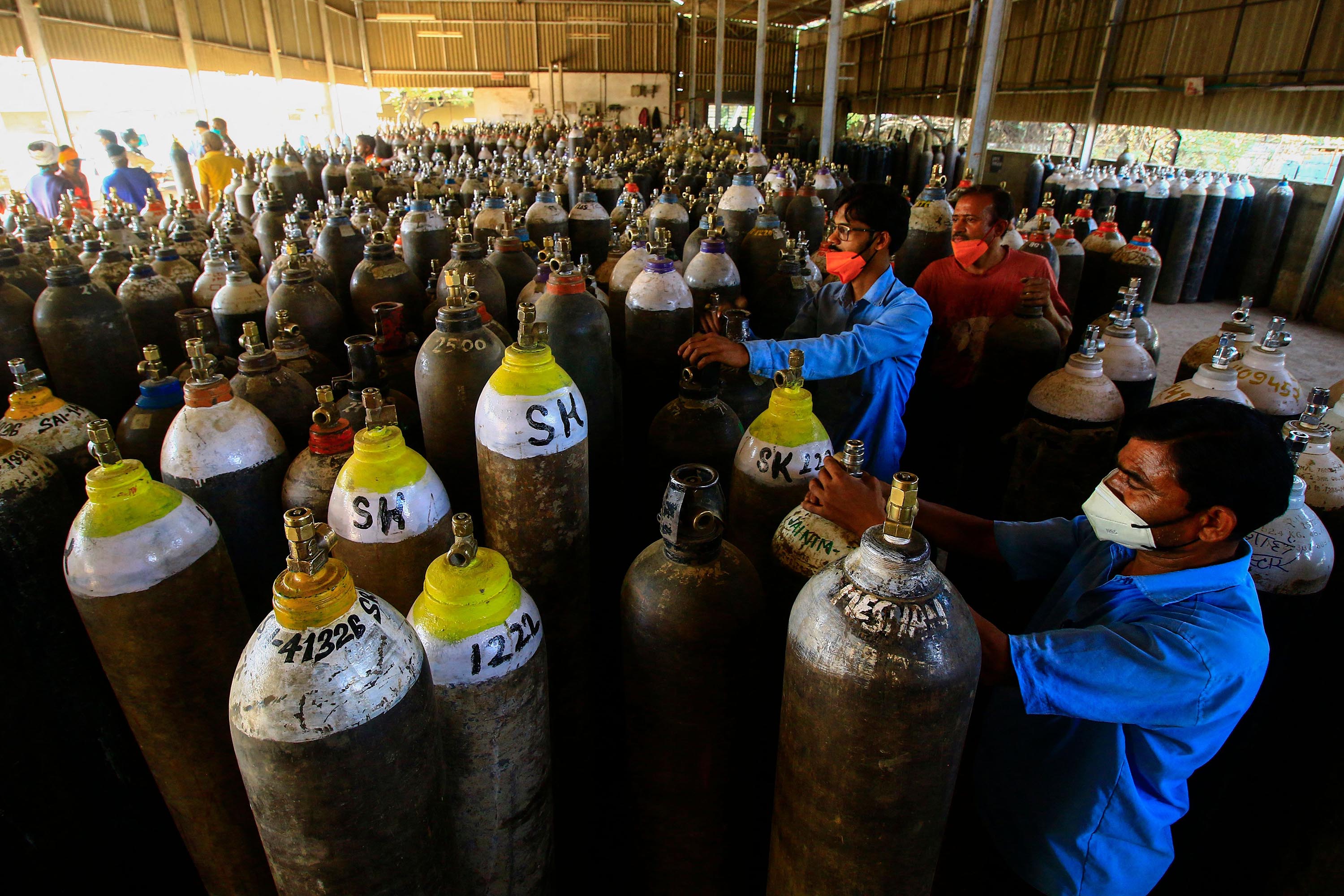 Workers prepare to fill oxygen cylinders for hospital treatment of Covid-19 patients, on the outskirts of Jabalpur, India, on April 18. 