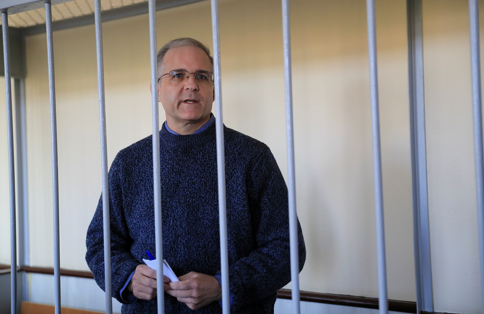 Former U.S. Marine Paul Whelan stands inside a defendants' cage before a court hearing in Moscow, Russia, on August 23, 2019