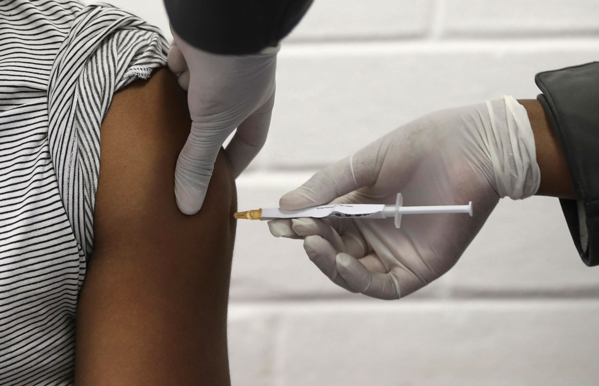 A volunteer receives an injection at a hospital in Johannesburg, South Africa on June 24 as part of Africa's first participation in a Covid-19 vaccine trial developed at the University of Oxford in Britain in conjunction with the pharmaceutical company AstraZeneca.