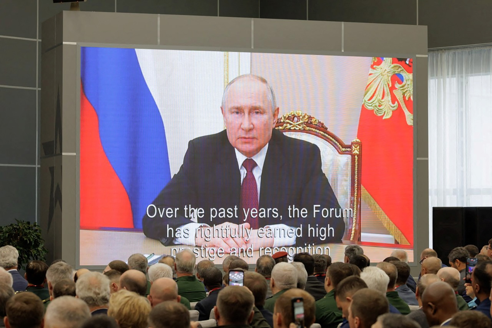 Participants listen to Russian President Vladimir Putin's address during the opening of the international military-technical forum Army-2023 at Patriot Congress and Exhibition Centre in the Moscow region, Russia, on August 14.