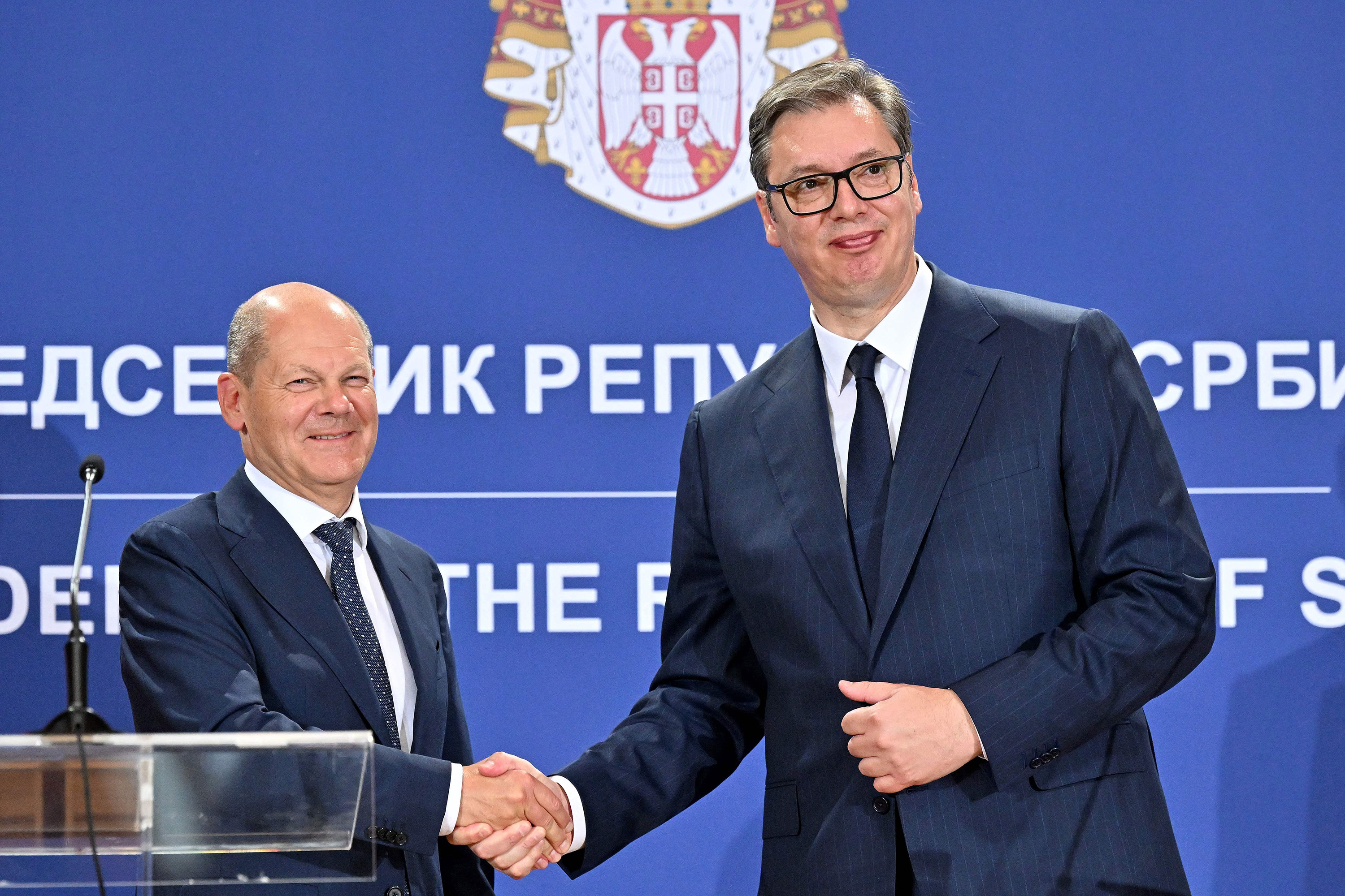 German Chancellor Olaf Scholz, left, shakes hands with Serbian President Aleksandar Vucic after a joint press conference in Belgrade, Serbia, on Friday.