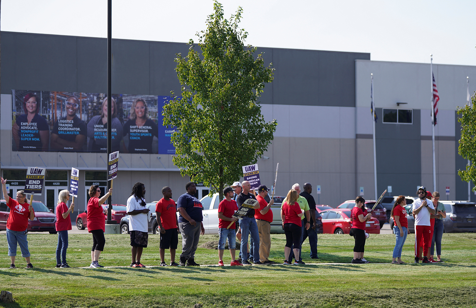 Striking UAW workers picket outside a GM processing facility in Burton, Michigan, on September 22.