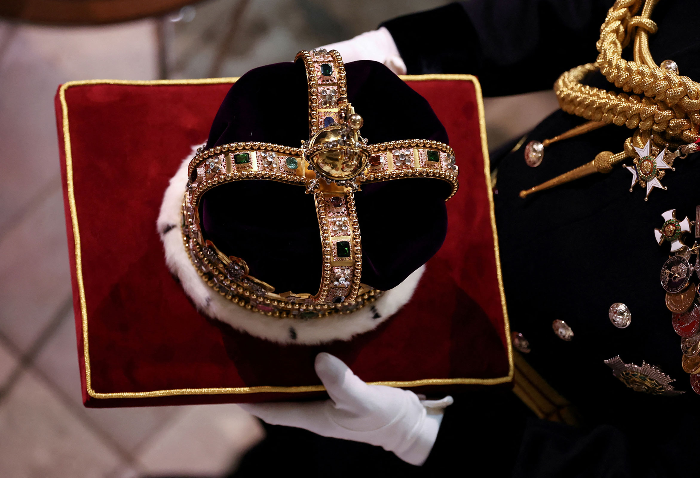 St Edward's Crown, used to crown the King during the coronation, is carried inside Westminster Abbey. 