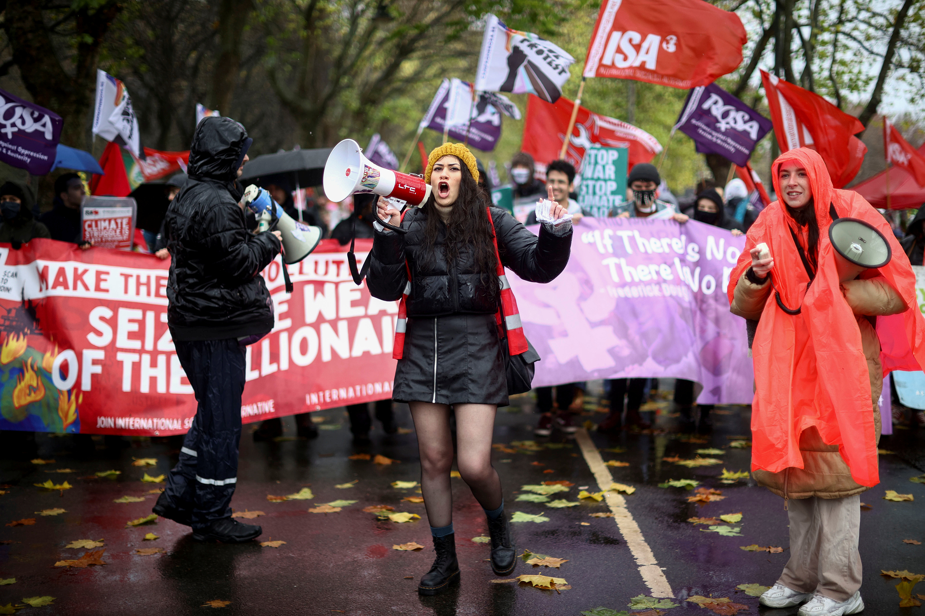 Demonstrators speak into megaphones during a protest as the COP26 UN Climate Change Conference takes place, in Glasgow, Scotland, on November 6. 