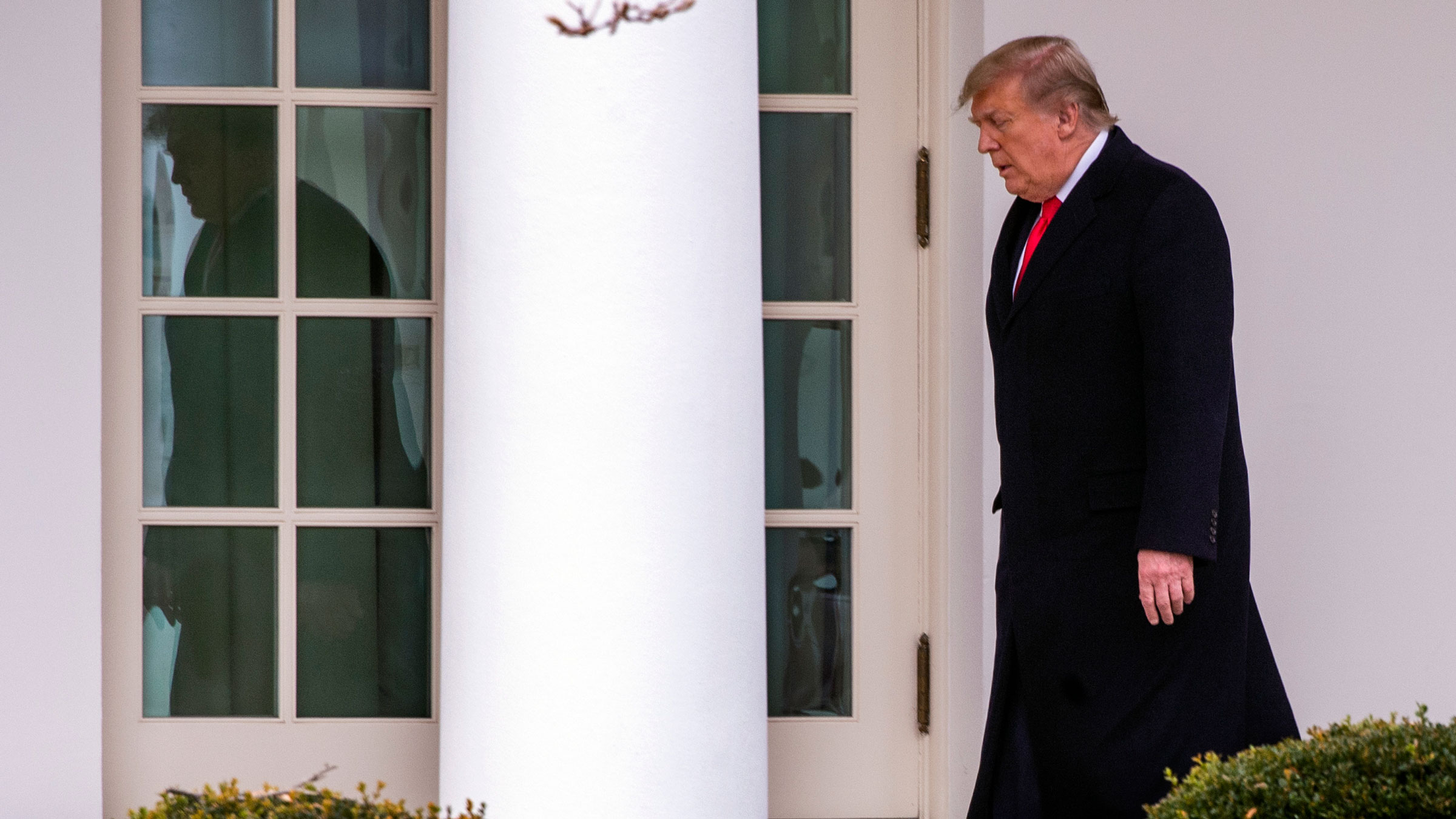 President Donald Trump walks to the Oval Office after returning from Florida on Thursday.
