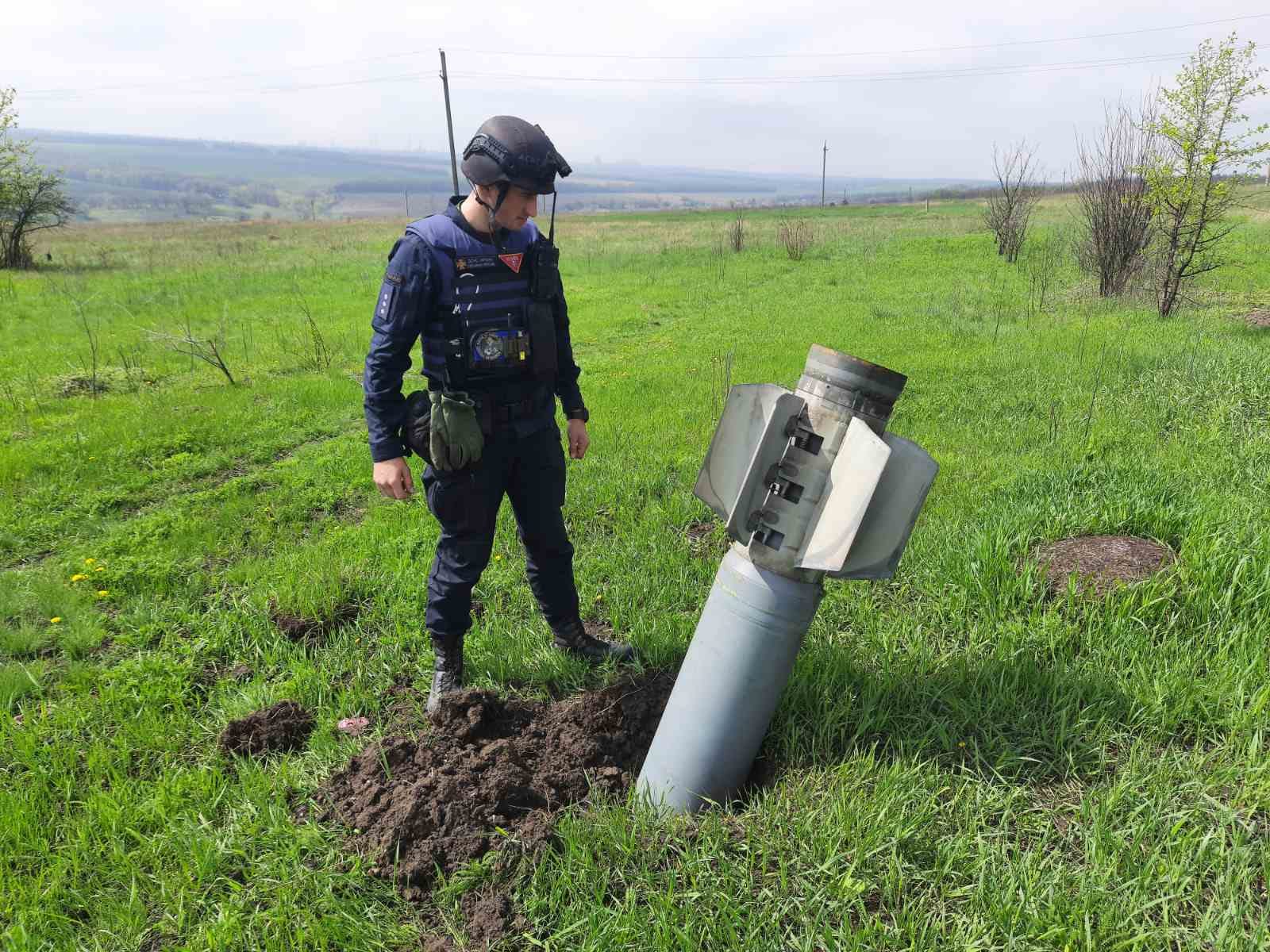A member of the State Emergency Service of Ukraine prepares to disable and remove a missile in Rubizhne in the Luhansk region of Ukraine, on April 27.