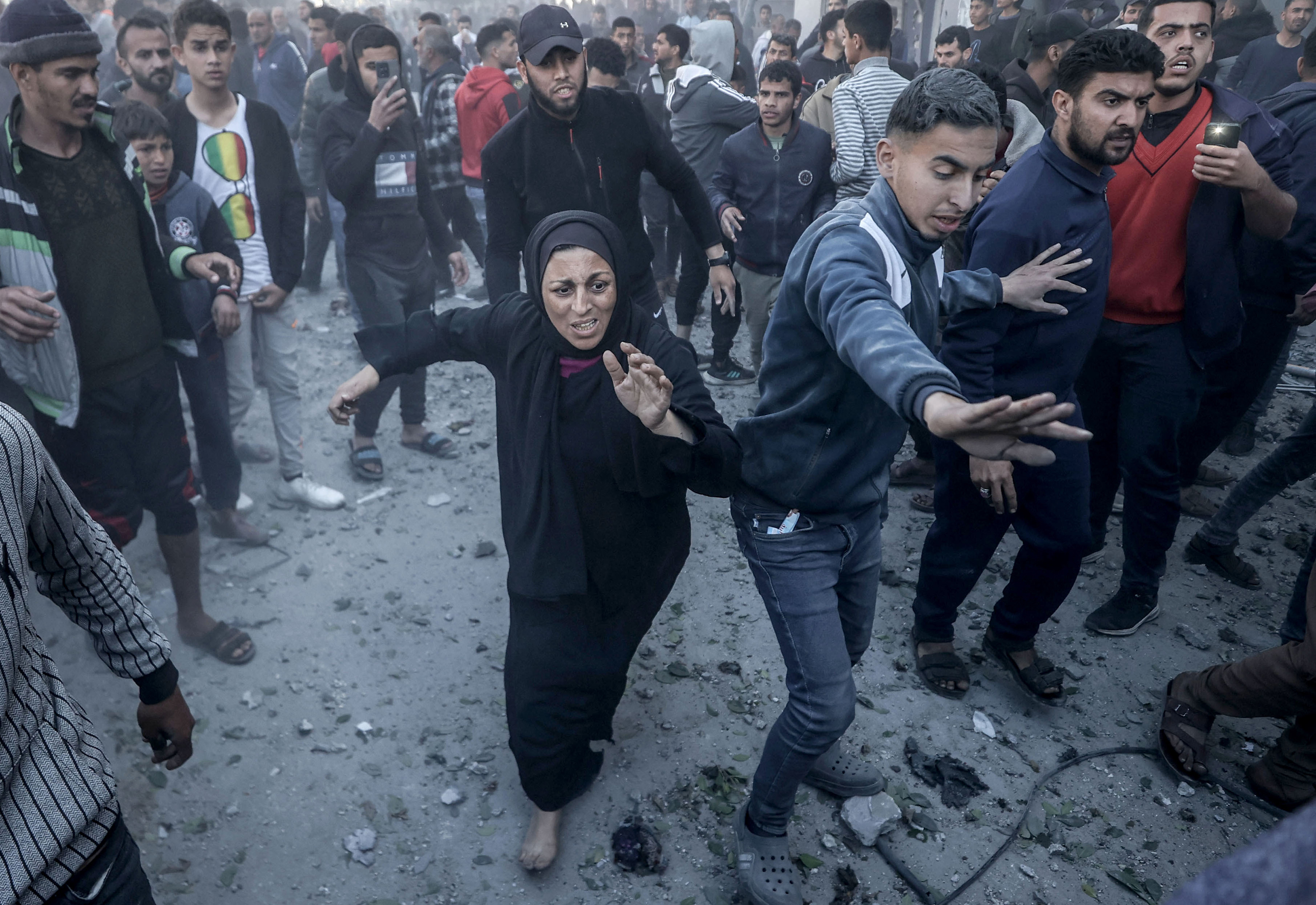  A woman runs to the scene to see her relative after an Israeli attack in Deir al-Balah, Gaza on February 17.