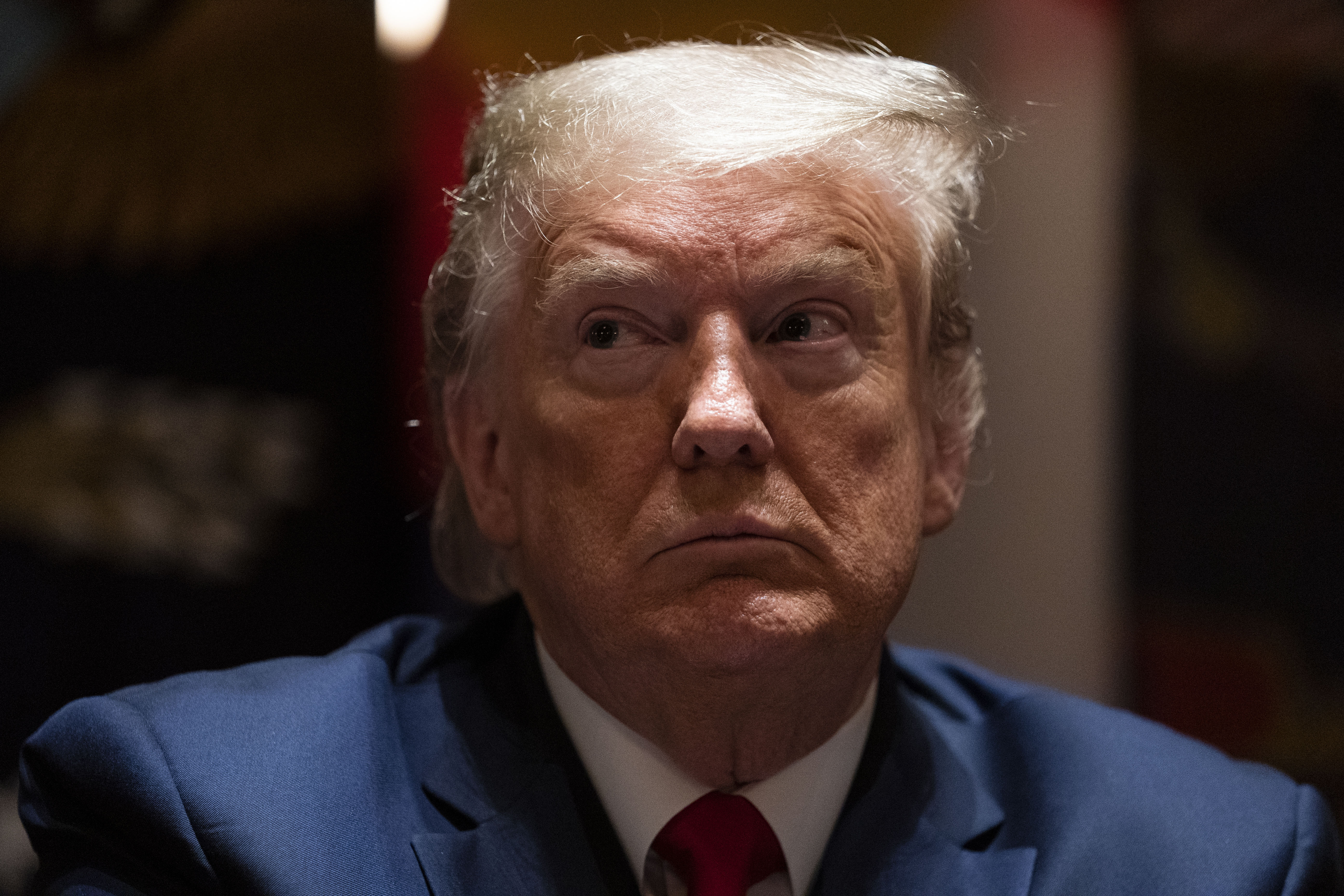 President Donald Trump listens during a meeting in the Cabinet Room of the White House on May 13.