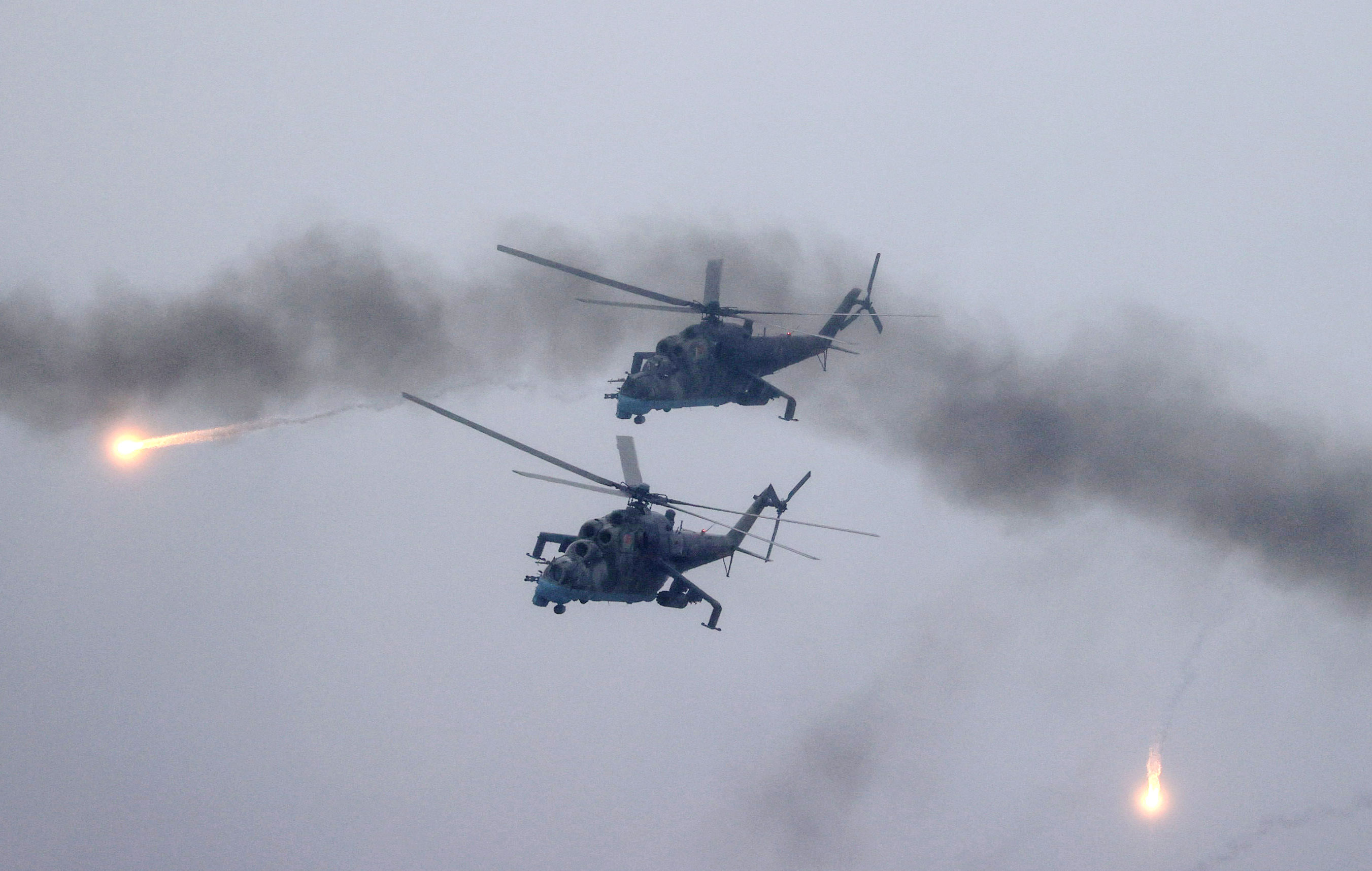 Belarusian Air Force Mi-24 helicopters fire during joint exercises of the armed forces of Russia and Belarus as part of an inspection of the Union State's Response Force on February 17, 2022. 