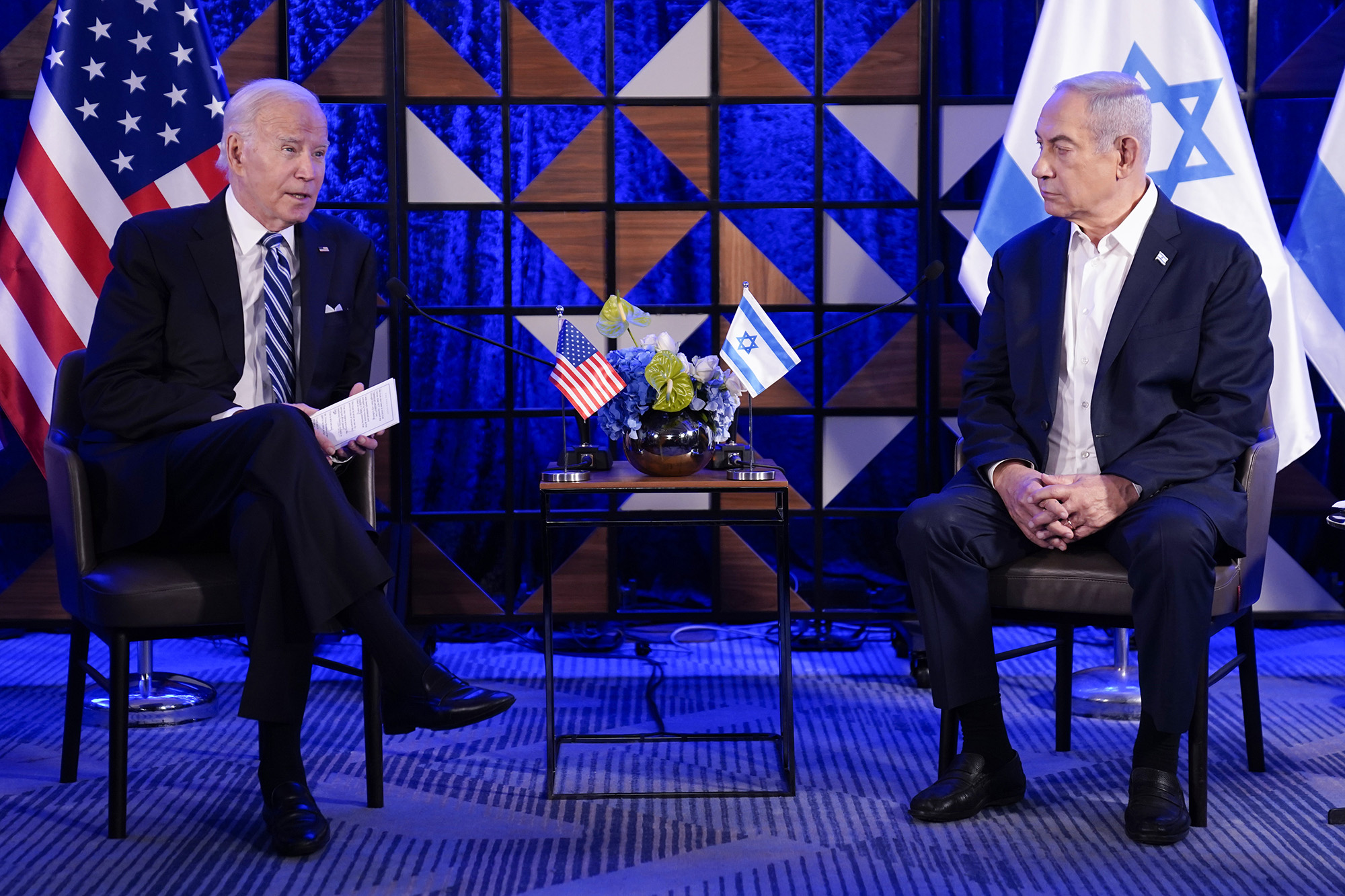 President Joe Biden, left, speaks with Israeli Prime Minister Benjamin Netanyahu on October 18, in Tel Aviv, Israel.
