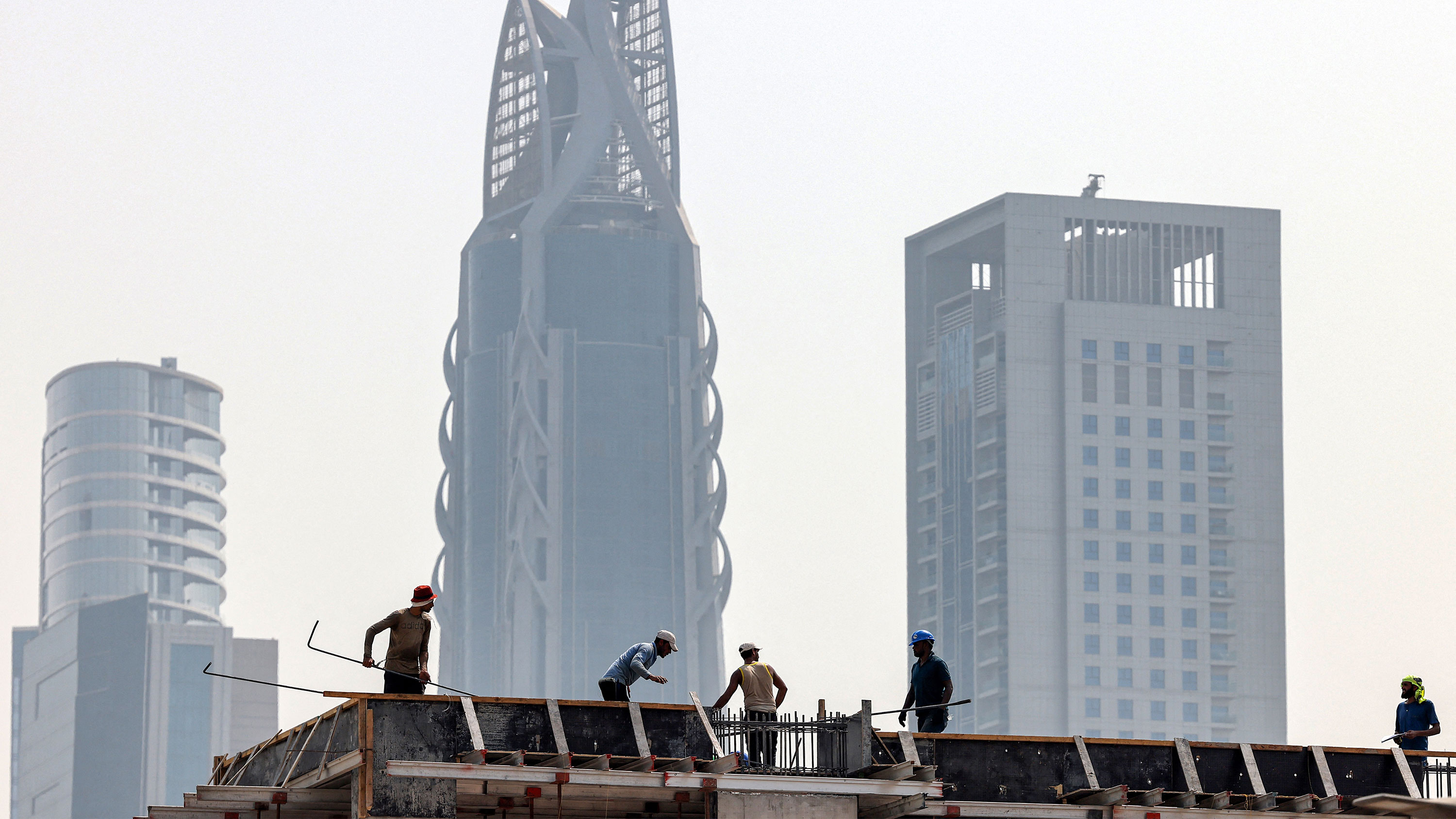 People work at a construction site in Dubai on Tuesday.