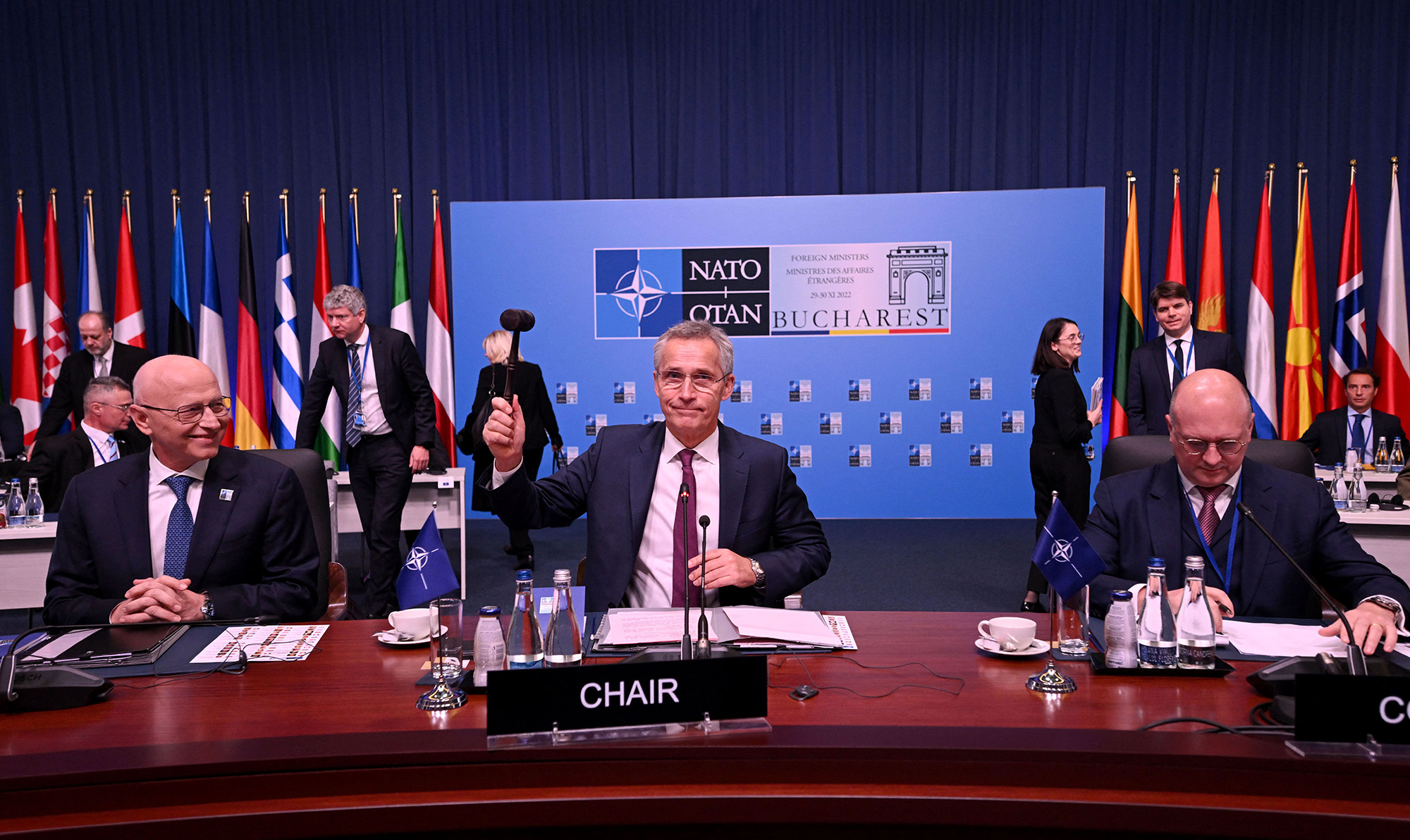 NATO Secretary General Jens Stoltenberg, center, opens the meeting of the NATO Ministers of Foreign Affairs in Bucharest, Romania, on November 30.