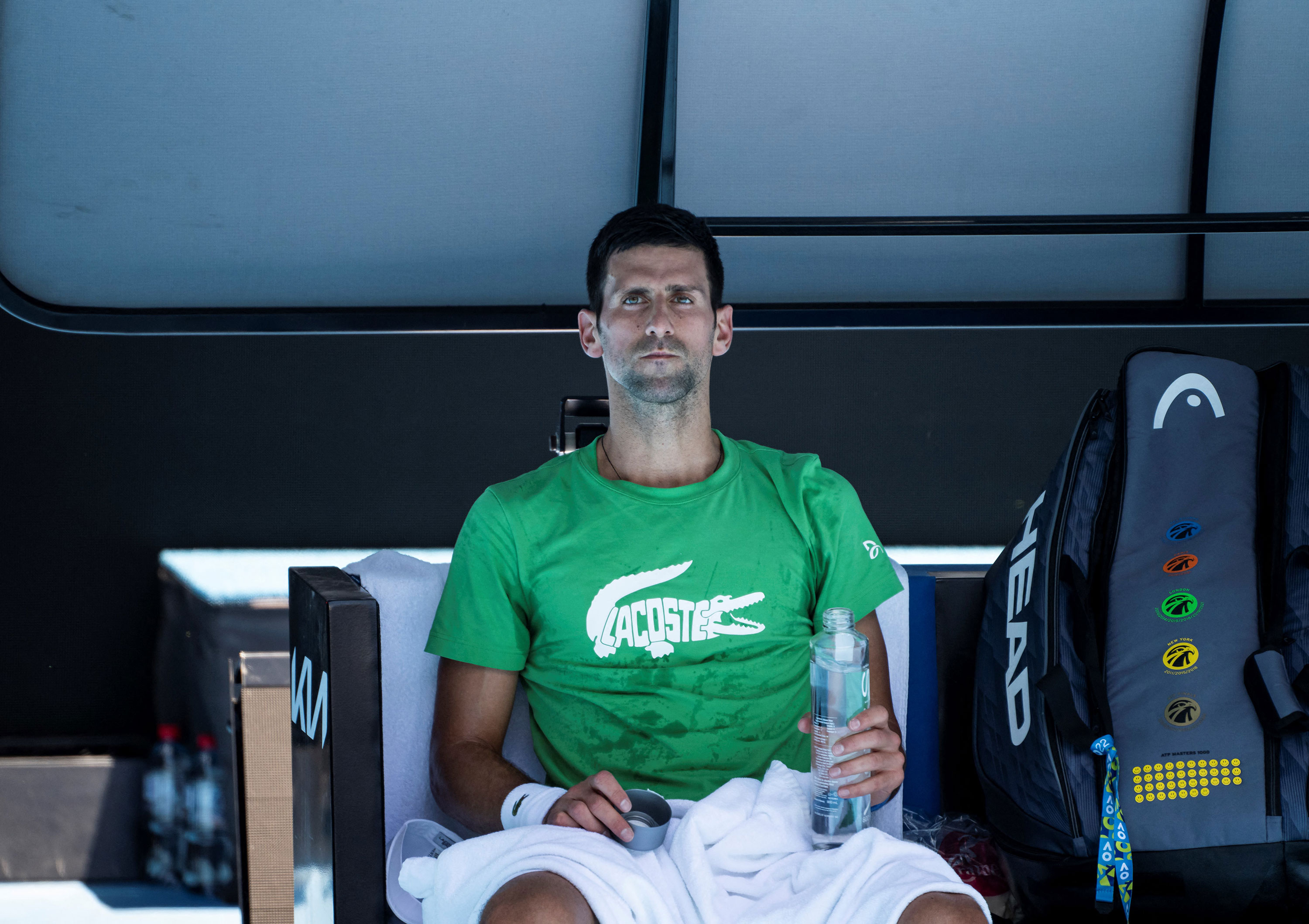 Novak Djokovic takes a break during a practice session in Melbourne on January 13.