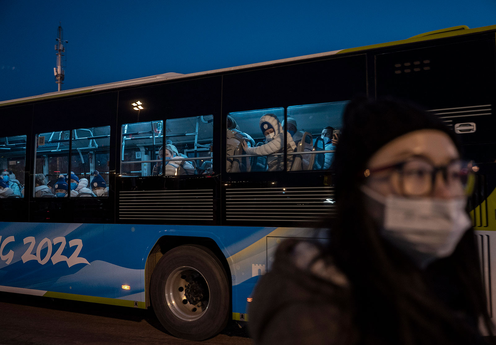 A bus filled with athletes travels within the "closed loop" system on February 4.