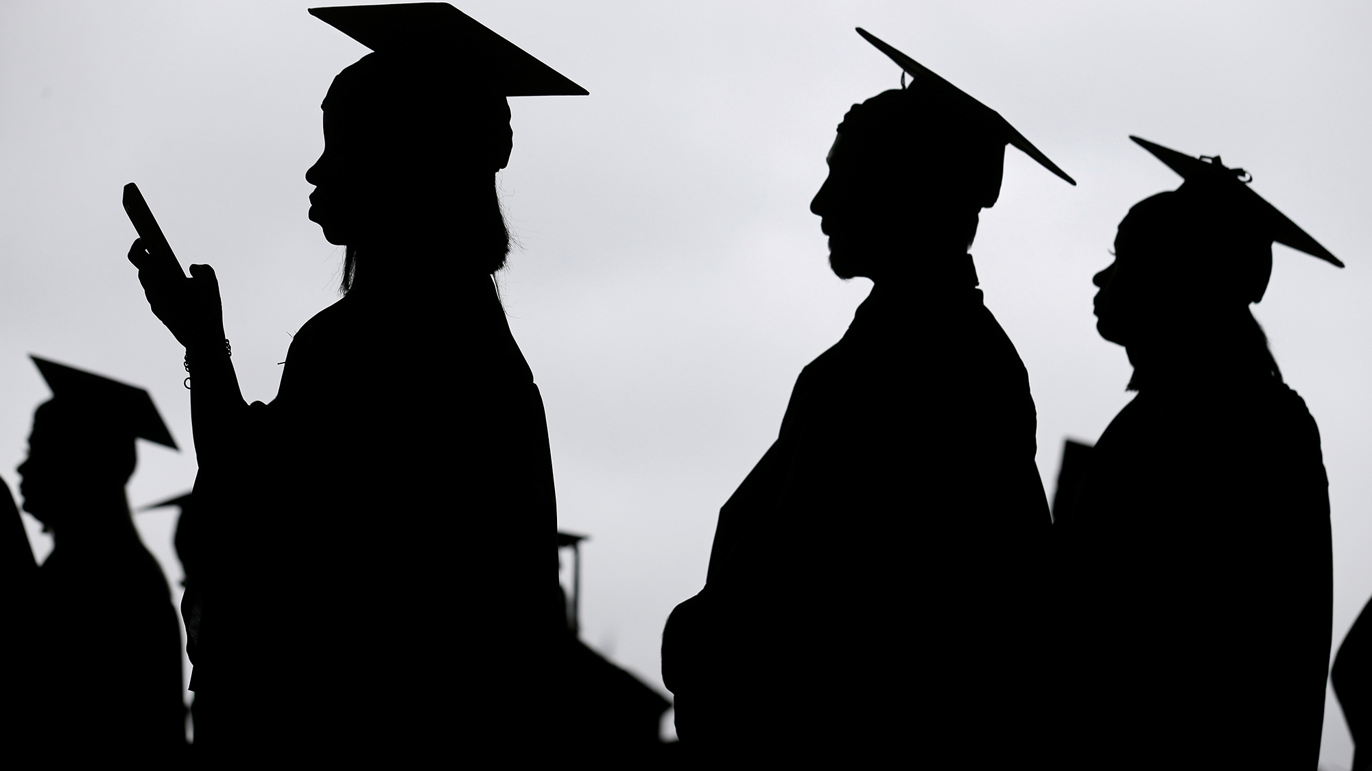 New graduates line up before the start of a community college commencement in East Rutherford, New Jersey,  on May 17, 2018.