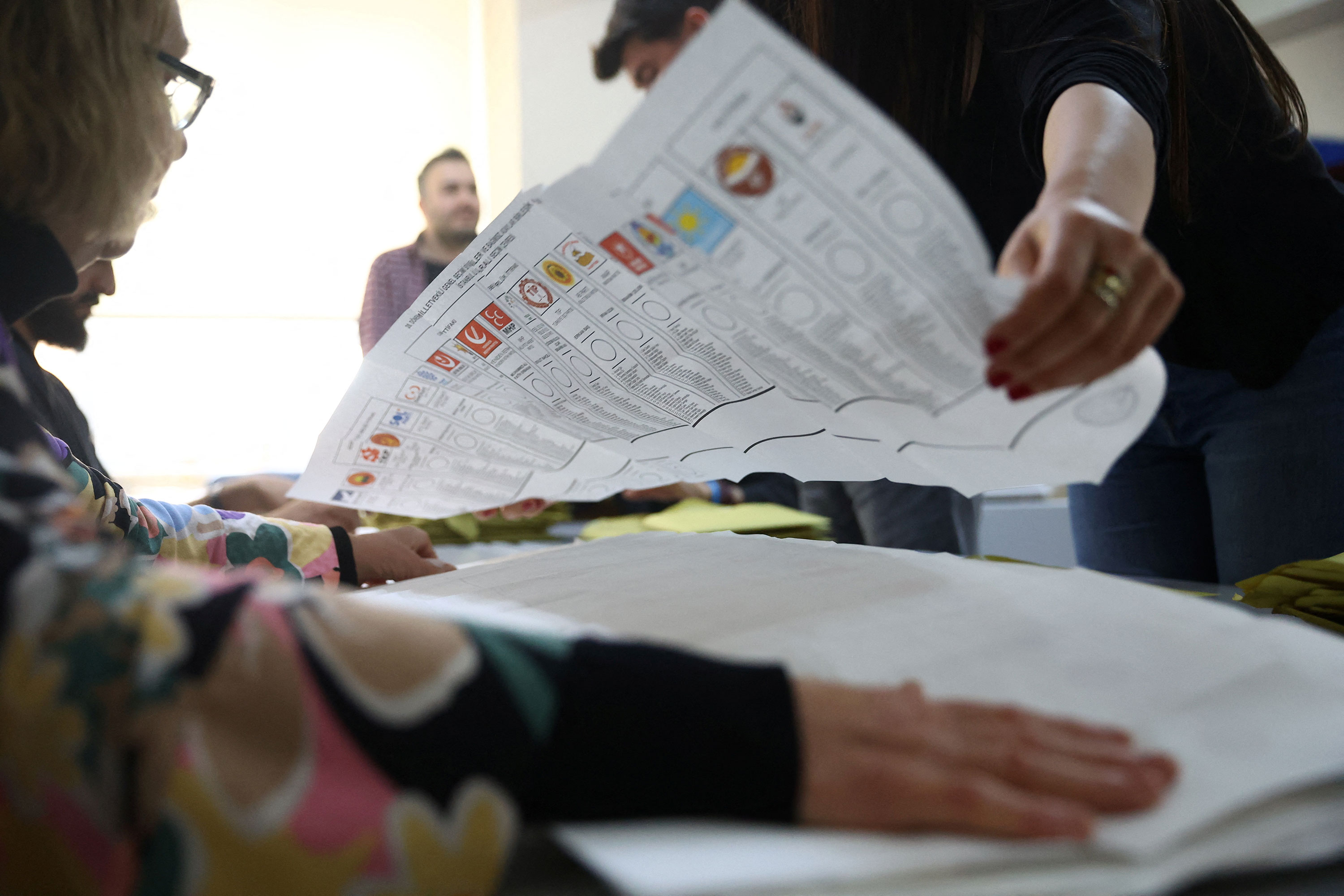 Election workers count ballots at a polling station inside a school in Istanbul on May 14. 