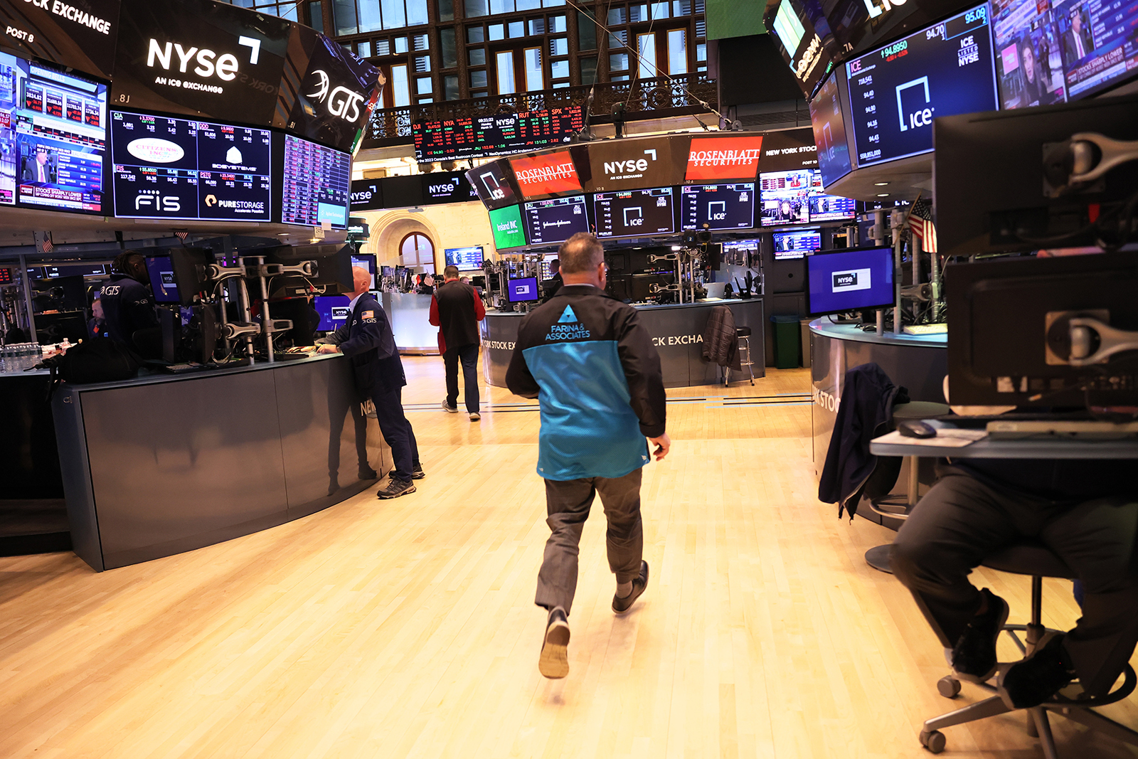 Traders work on the floor of the New York Stock Exchange during morning trading on March 13.