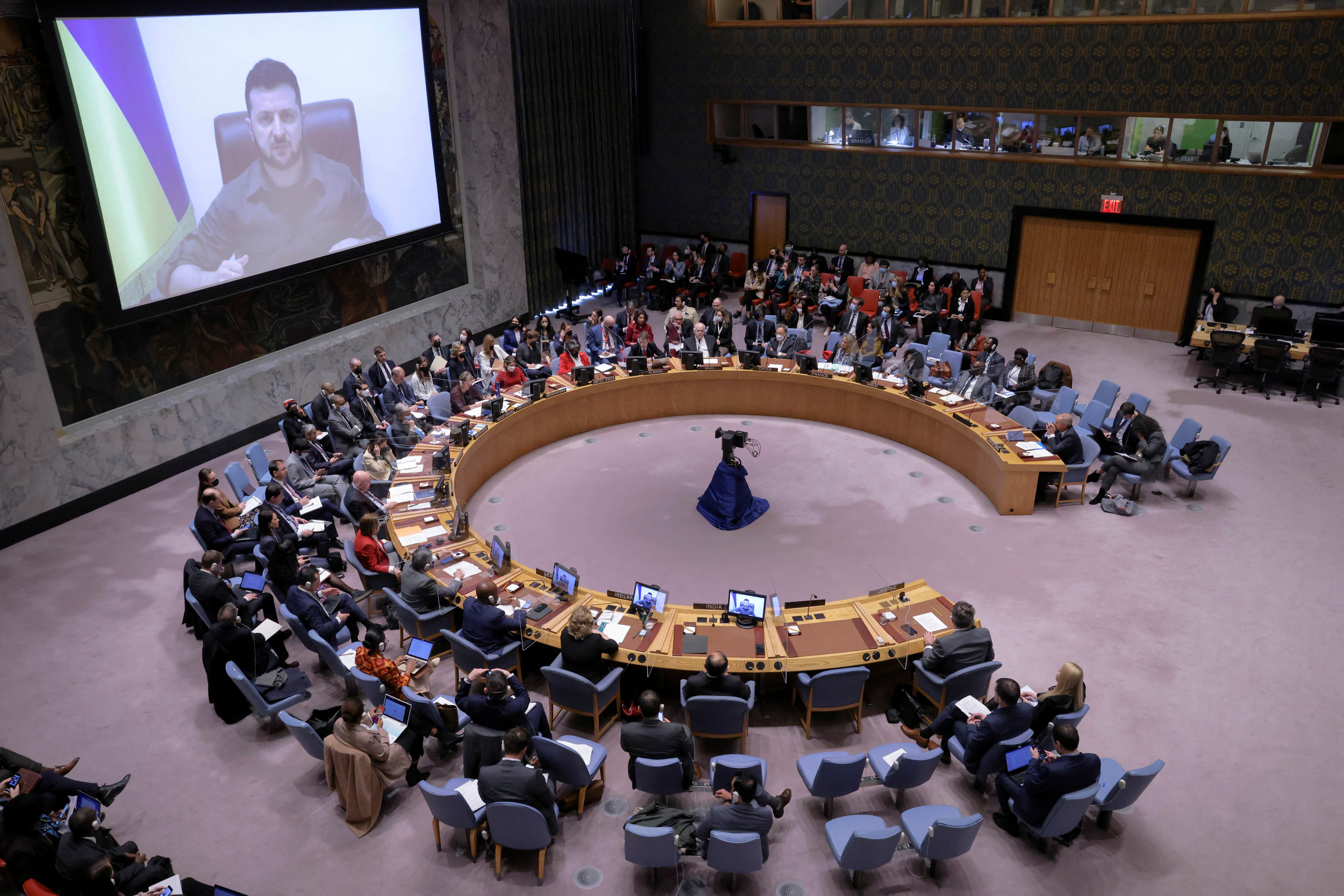 Ukrainian President Volodymyr Zelensky appears on a screen as he addresses the United Nations Security Council via video link during a meeting at the United Nations Headquarters in Manhattan, New York City, on April 5.