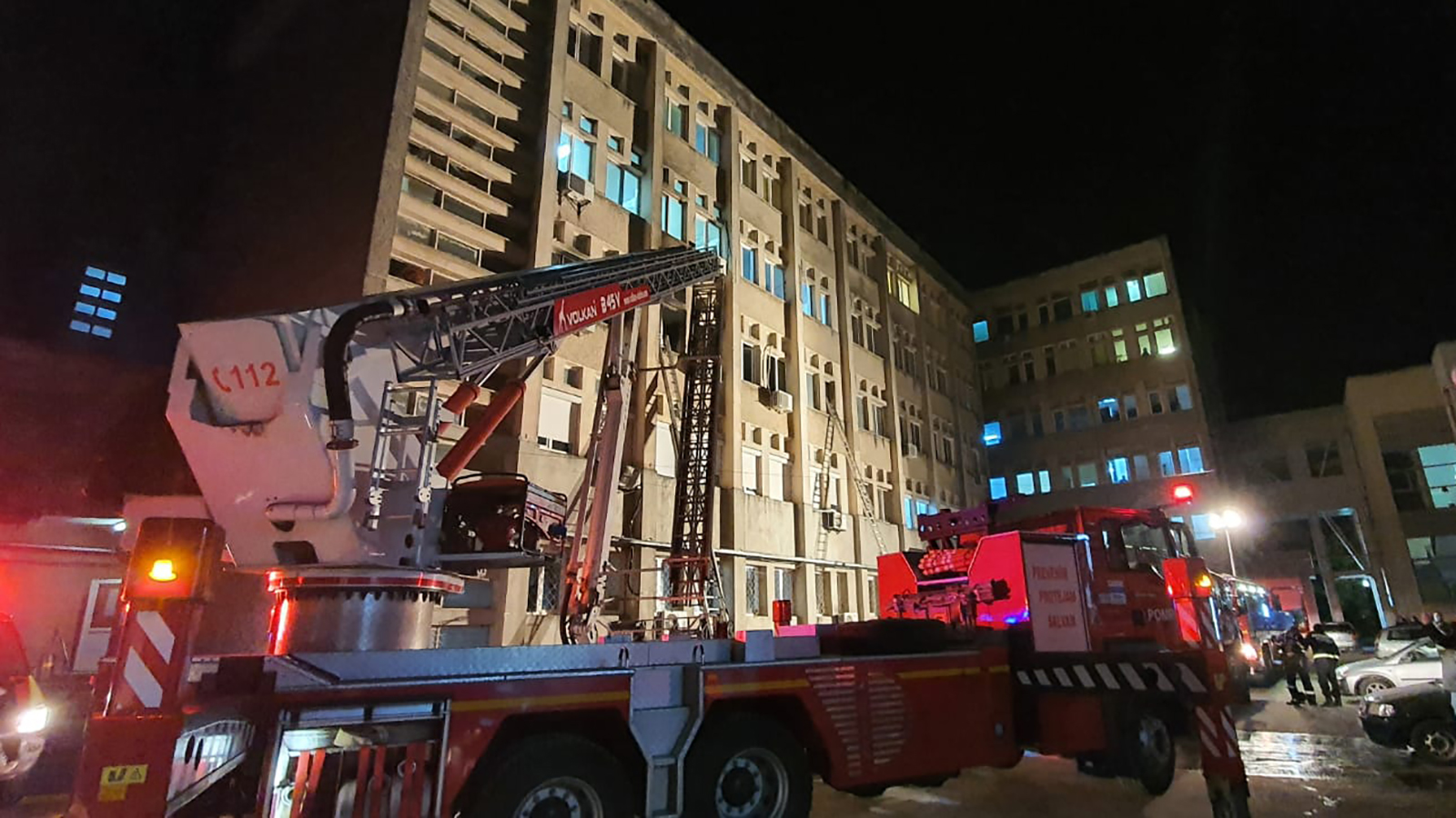 Members of the emergency services work at the scene of a hospital fire where the intensive care unit was burned in Piatra Neamt, Romania, on November 14.