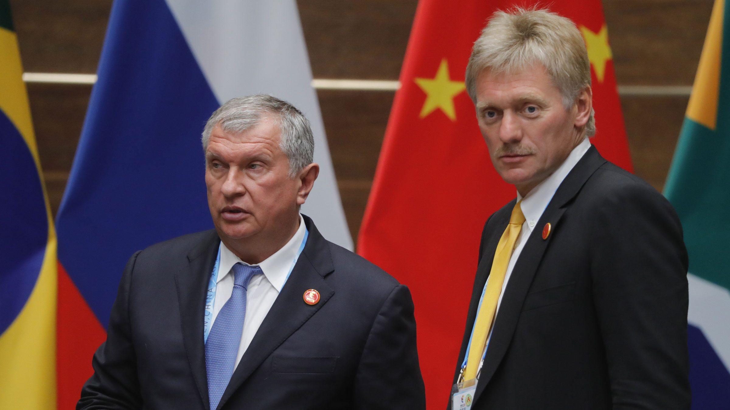 Rosneft CEO Igor Sechin, left, and Russian presidential spokesman Dmitry Peskov attend a summit in China in 2017.