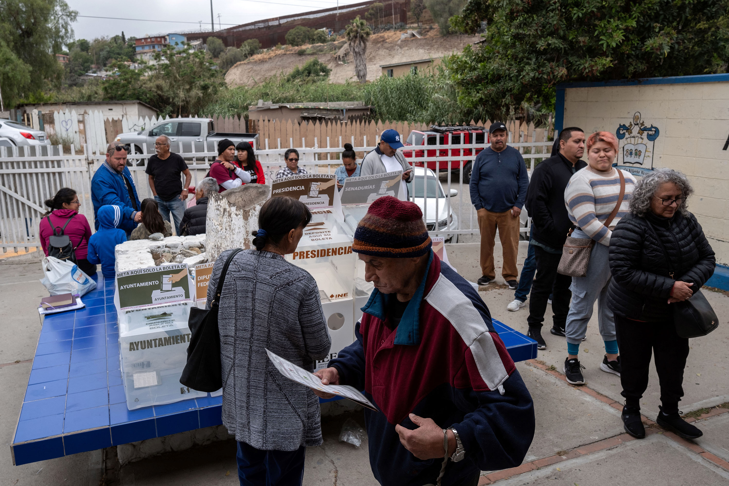 People queue to vote at a polling station in Colonia Libertad, near the US-Mexico border in Tijuana, Mexico, on June 2. 