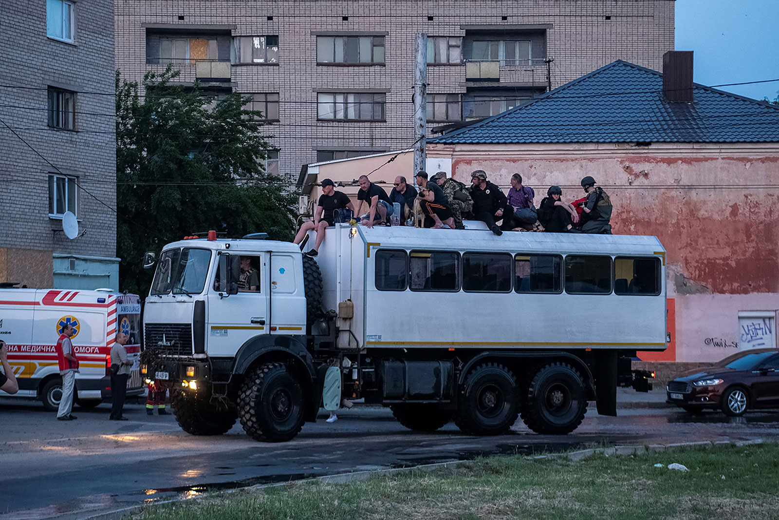 Rescuers evacuate residents from Kherson, Ukraine on Tuesday, June 6.