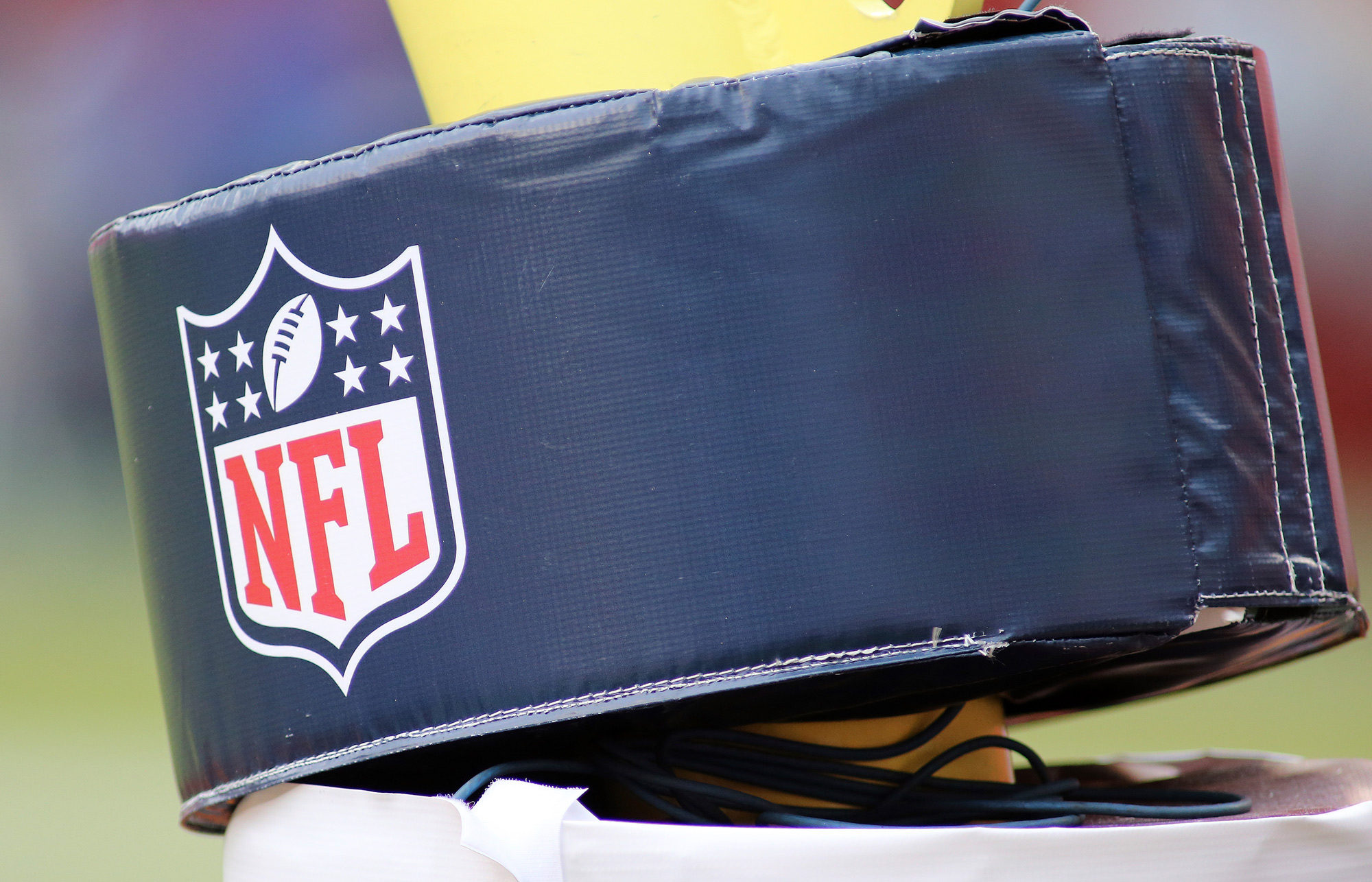 A close up an NFL football logo on a goalpost is seen during an NFL football game on October 11 in Landover, Maryland. 