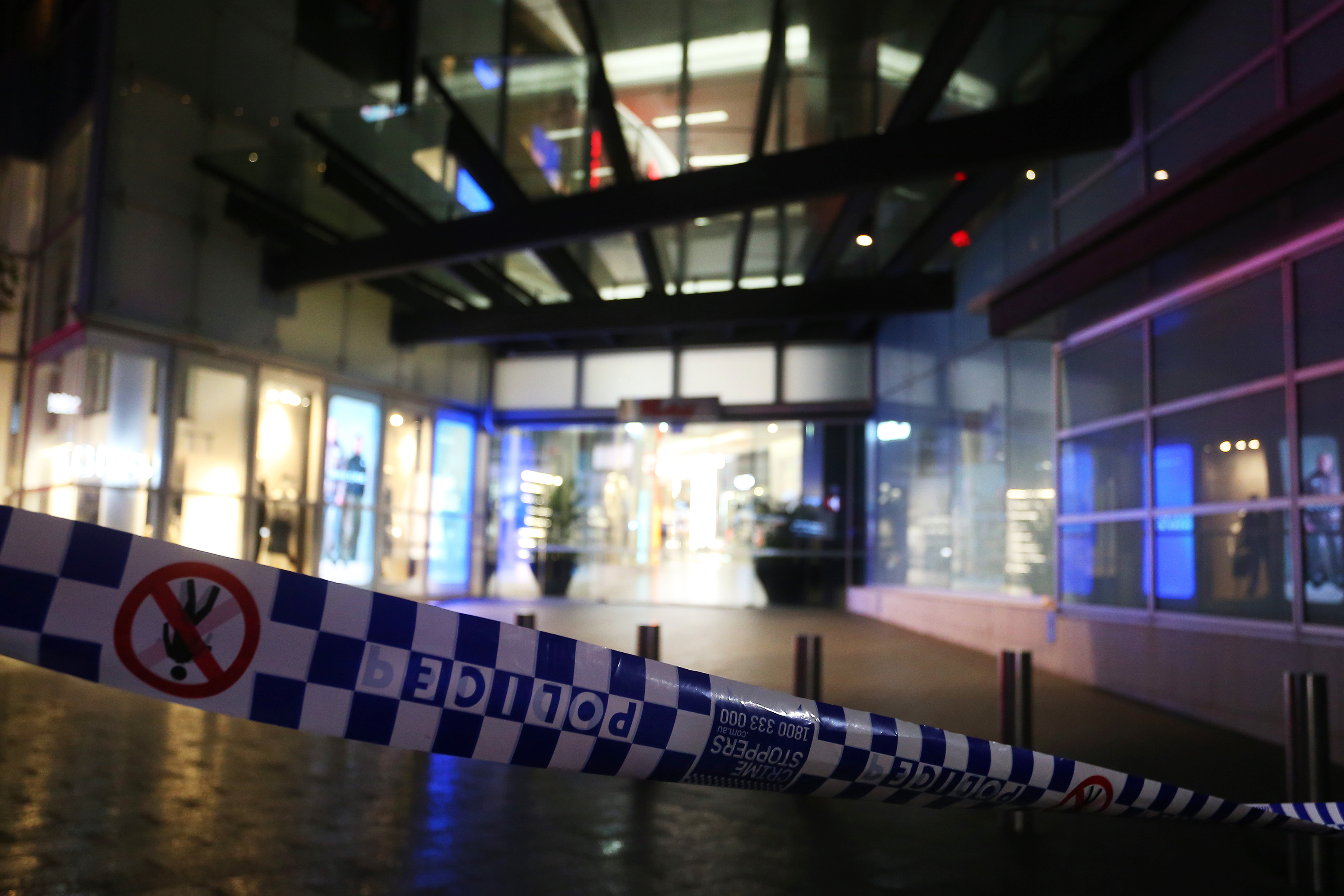 Police tape surrounds the entrance to Westfield Bondi Junction shopping center in Australia, on April 13. 