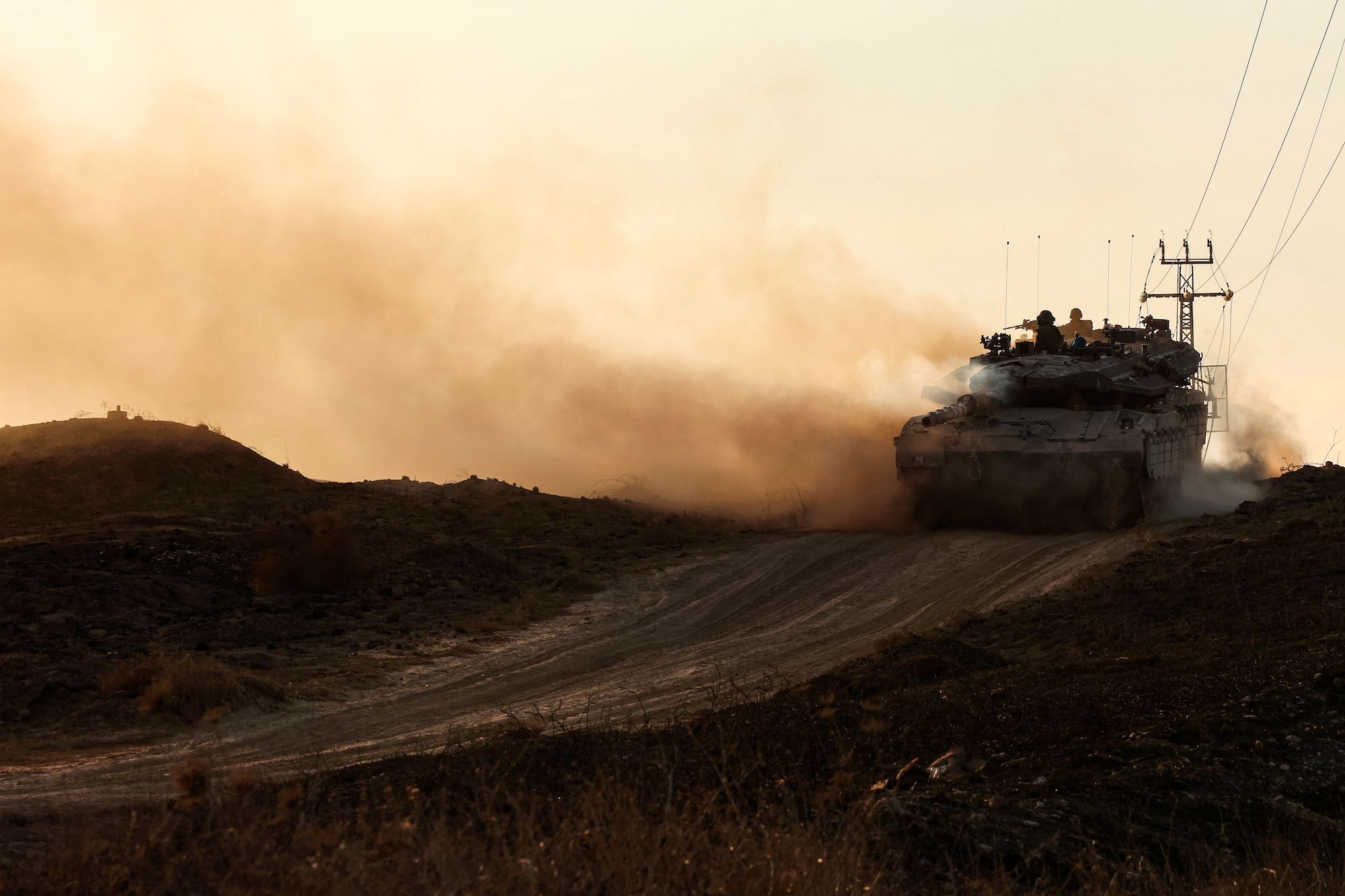 An Israeli tank moves along the border with Gaza on October 18.