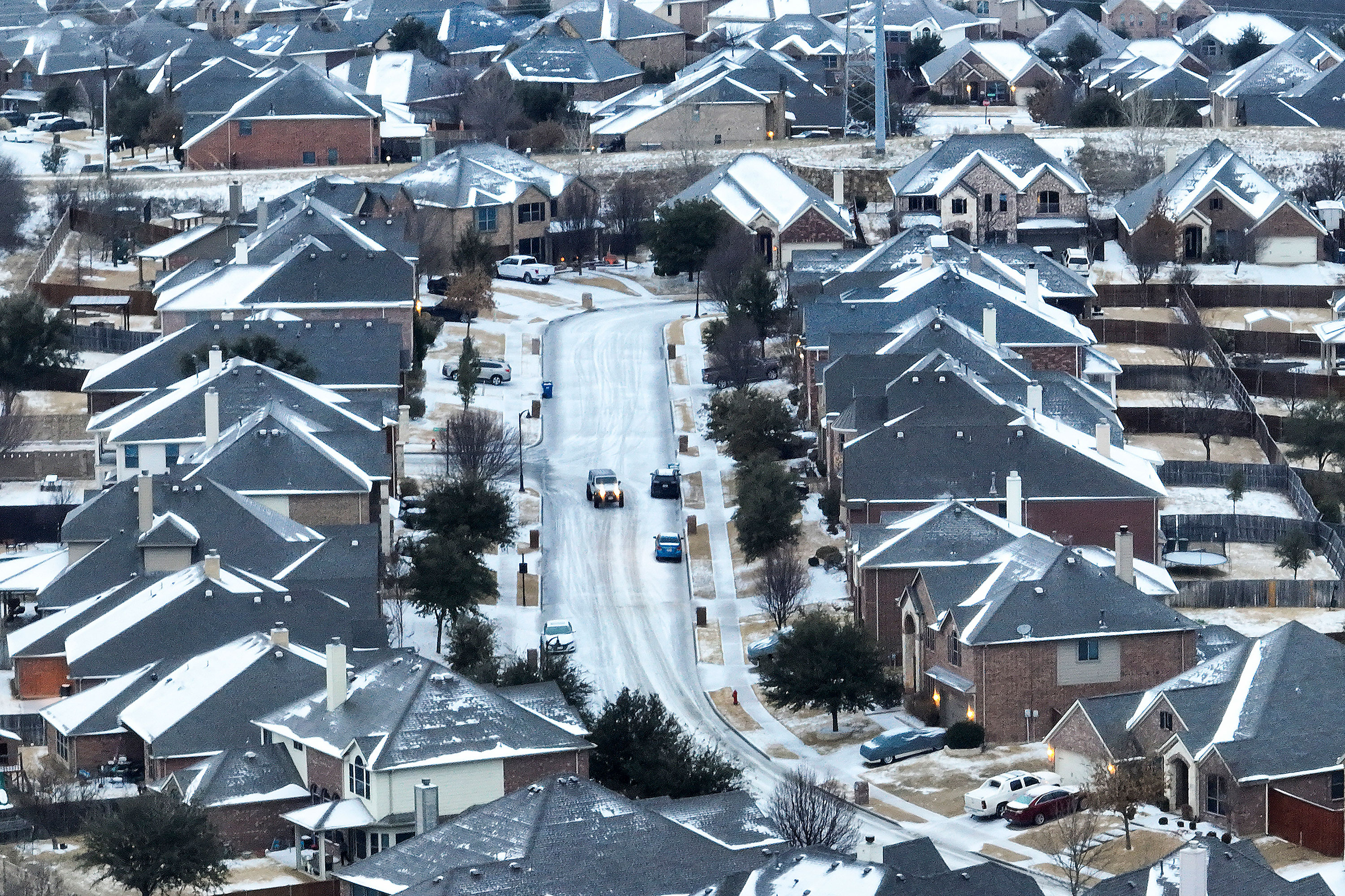 An icy mix covers a subdivision in Roanoke, Texas, on Monday.