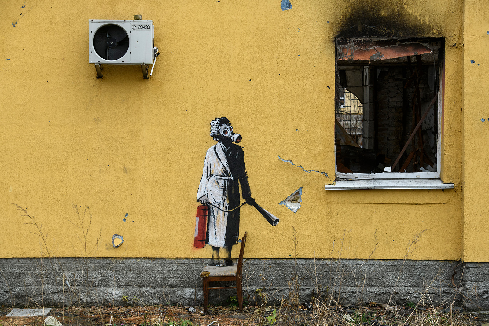 Graffiti at the wall of a destroyed residential building in Hostomel on Sunday.