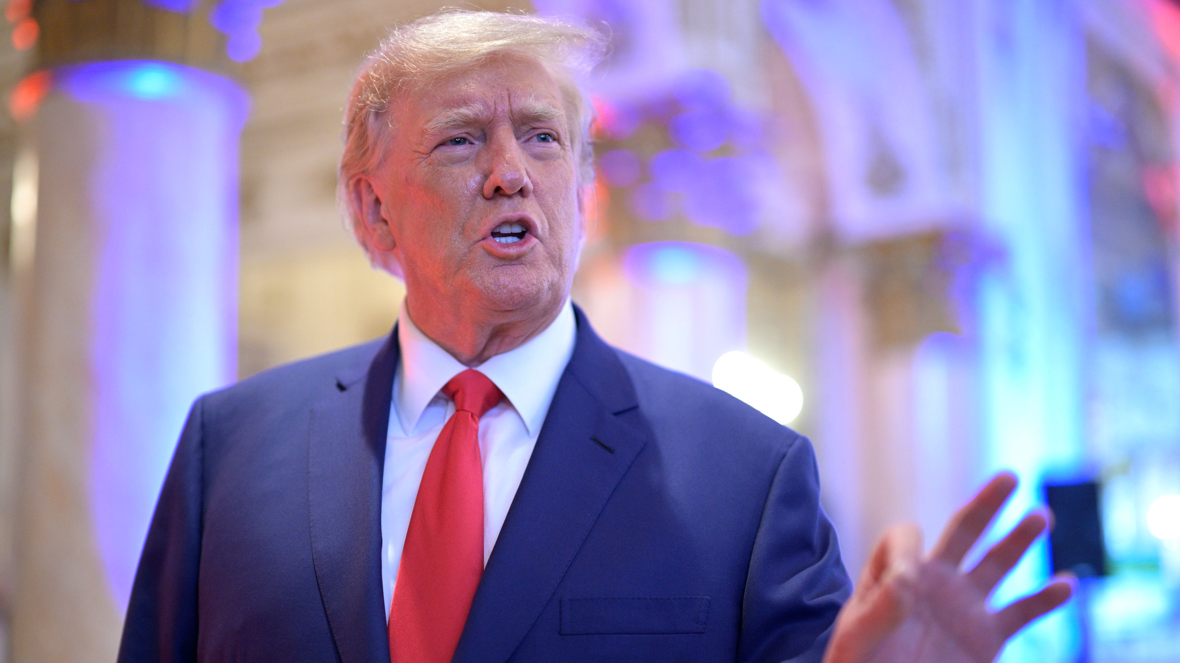 Former President Donald Trump answers questions from reporters on Tuesday.