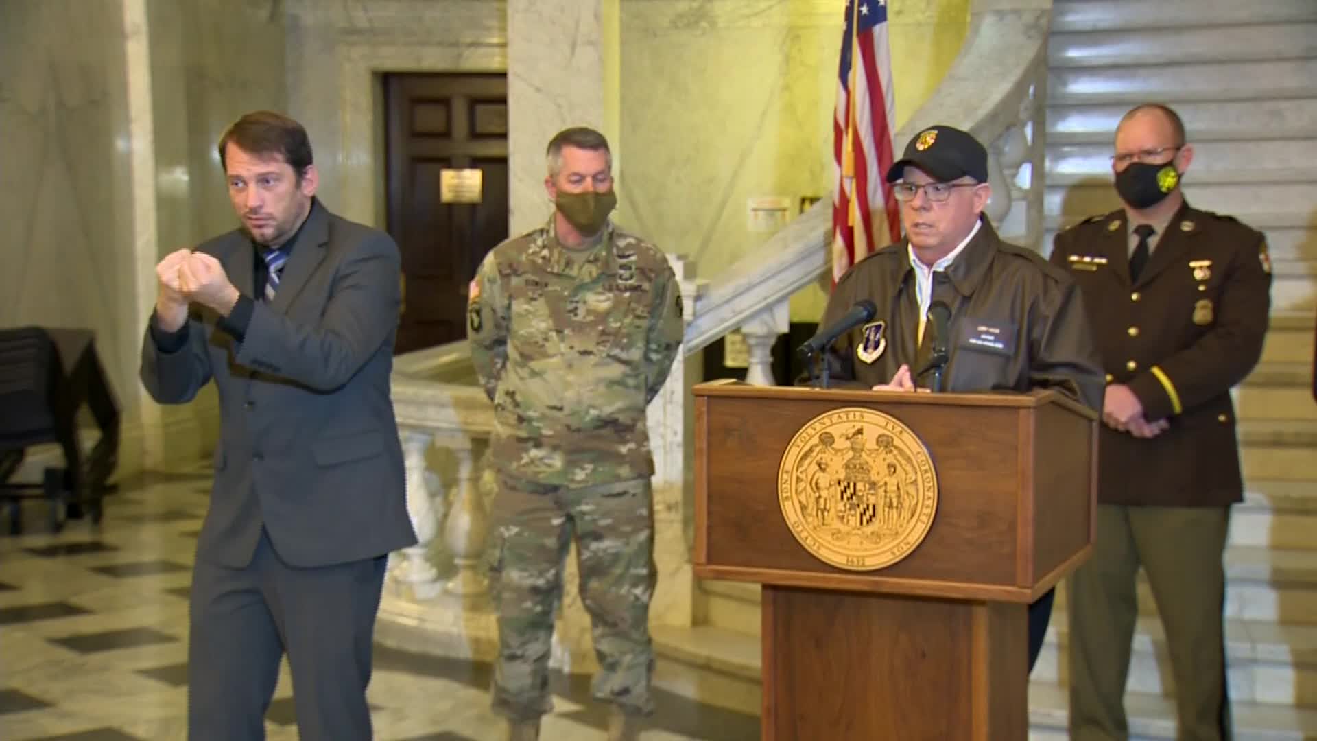 Maryland Gov. Larry Hogan, right, speaks during a press conference on January 7.