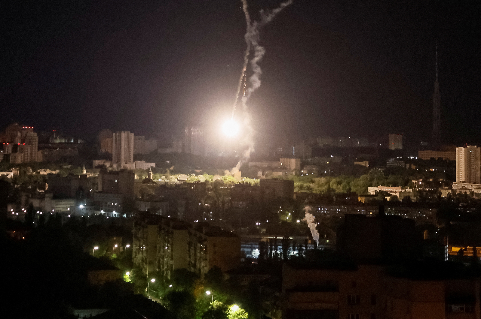 Explosion of a missile is seen in the sky over the city during a Russian missile strike in Kyiv, Ukraine, on May 16.