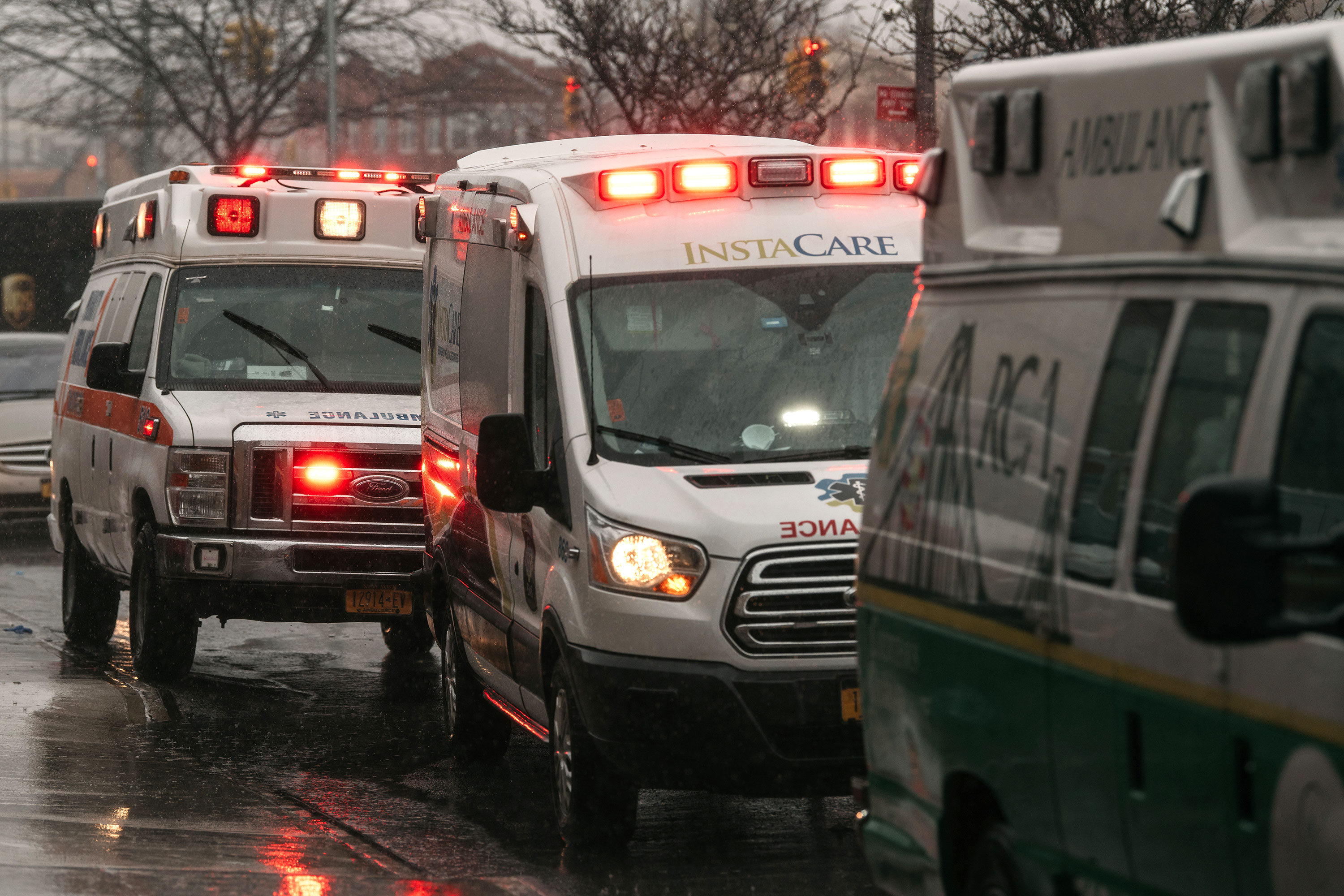 Parked ambulances sit on the street at Brookdale Hospital Medical Center on April 13, in New York City. 