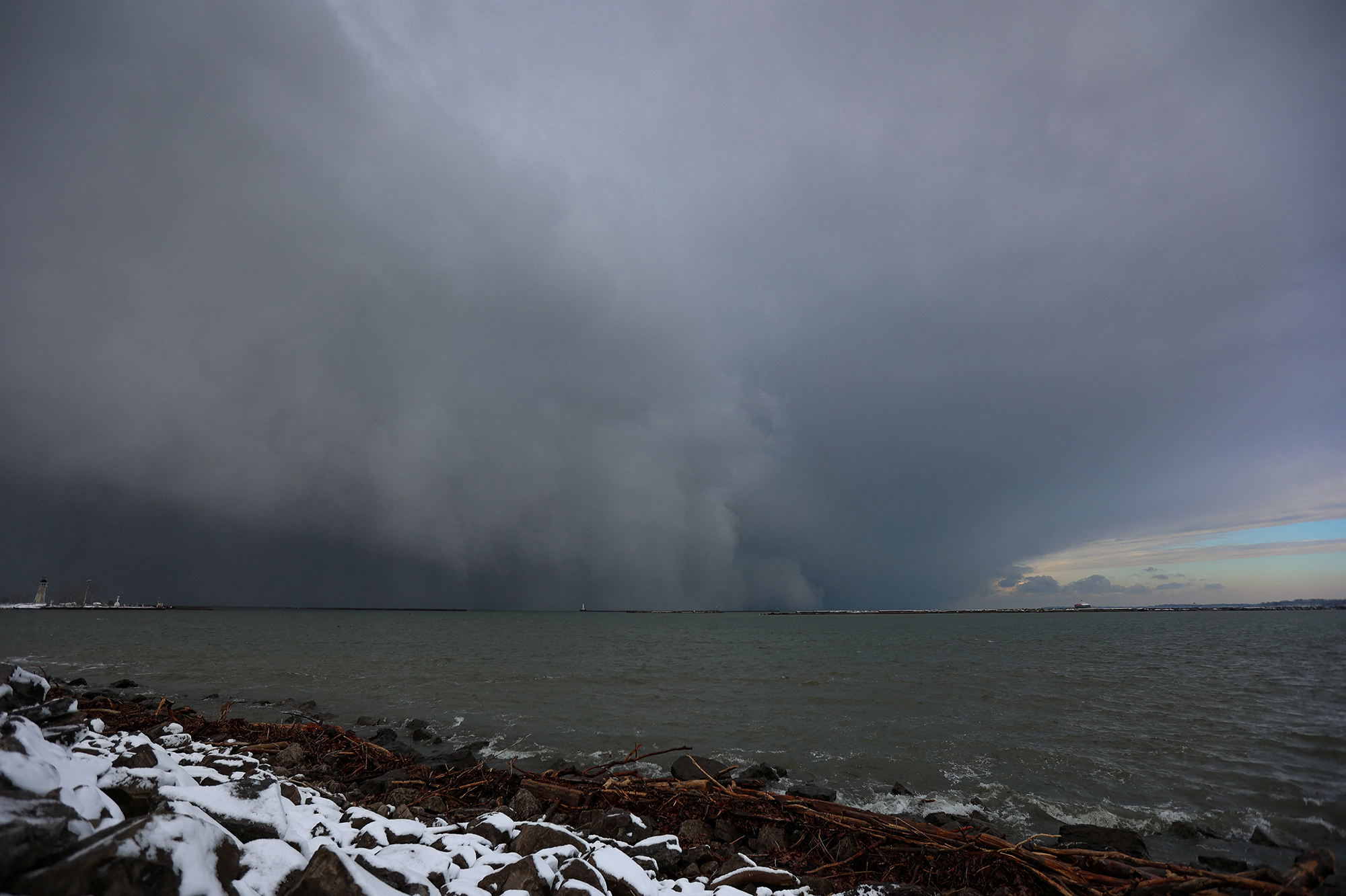 A cloud of snow is seen crossing Lake Erie as extreme winter weather hits Buffalo, New York on Friday