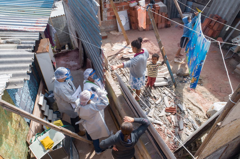 Health workers visit a squatters camp to conduct examinations in Sao Bernardo do Campo, greater Sao Paulo area, Brazil, on June 3.