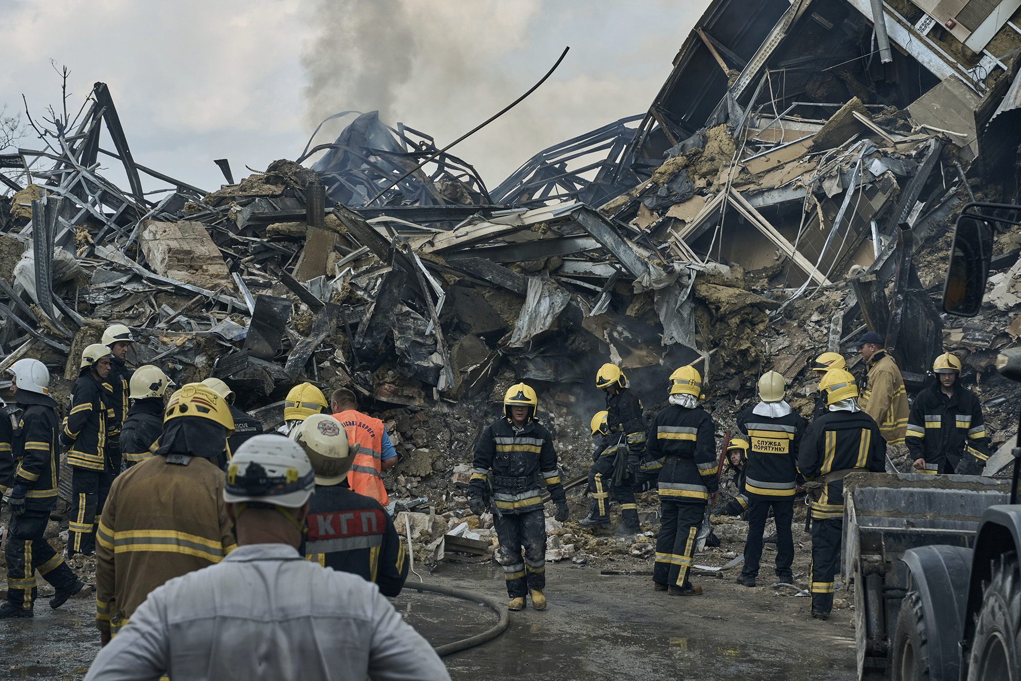 Emergency service personnel work at the site of a destroyed building after a Russian attack in Odesa, Ukraine, on July 20.