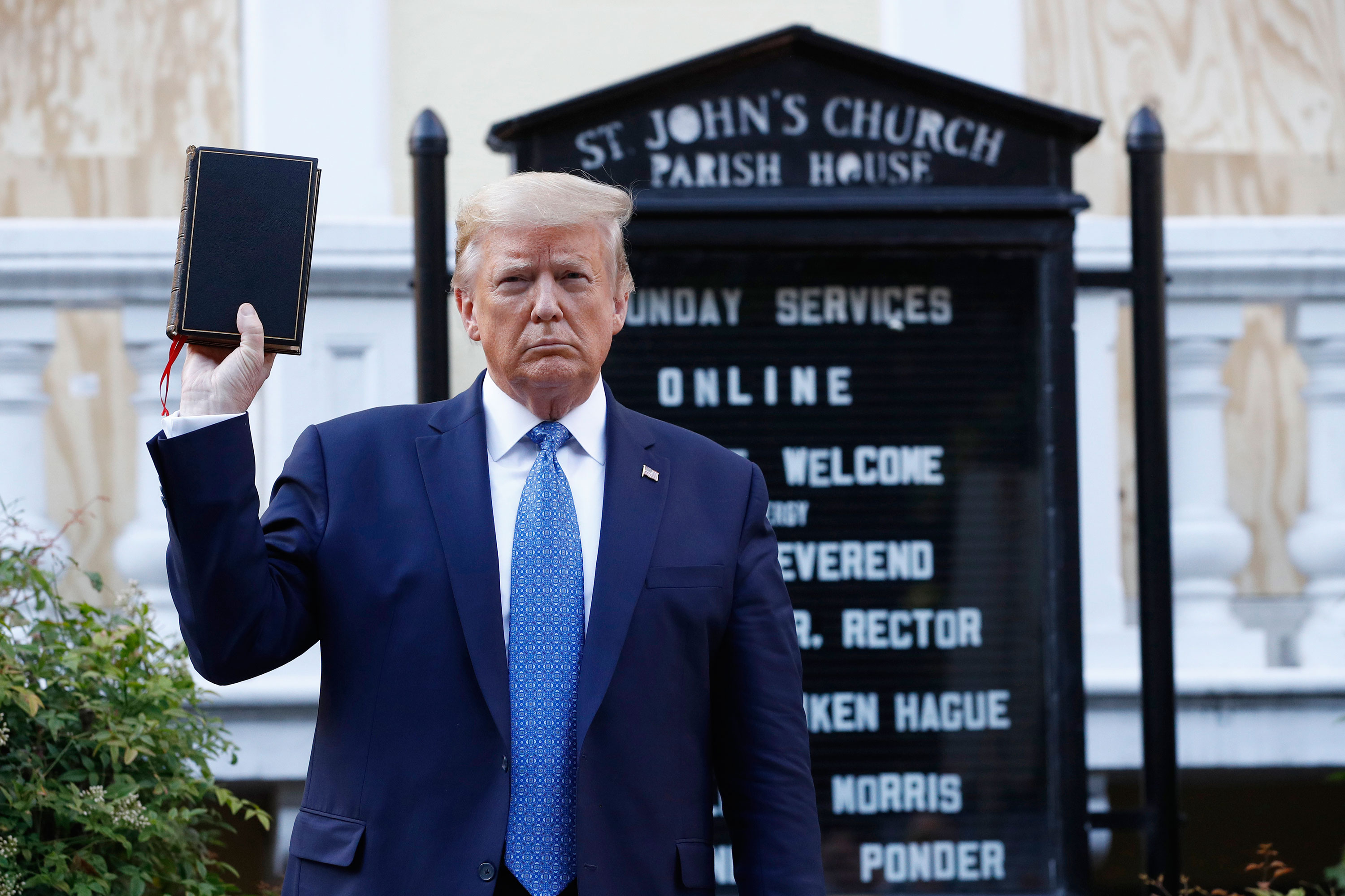 President Donald Trump holds a Bible as he visits outside St. John's Church on Monday in Washington. 