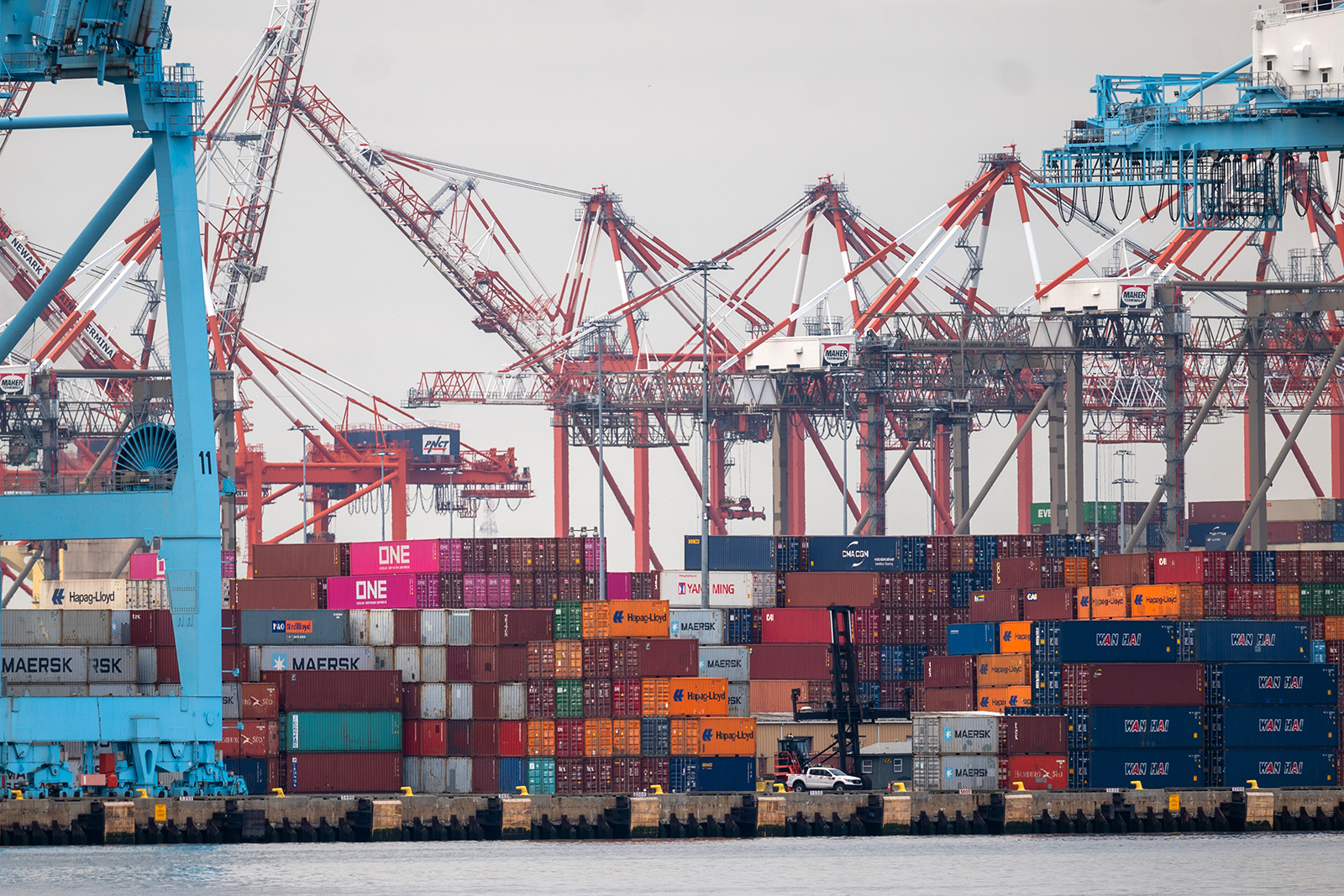 Cranes stand over shipping containers at the Port of Newark on March 26 in New Jersey. 