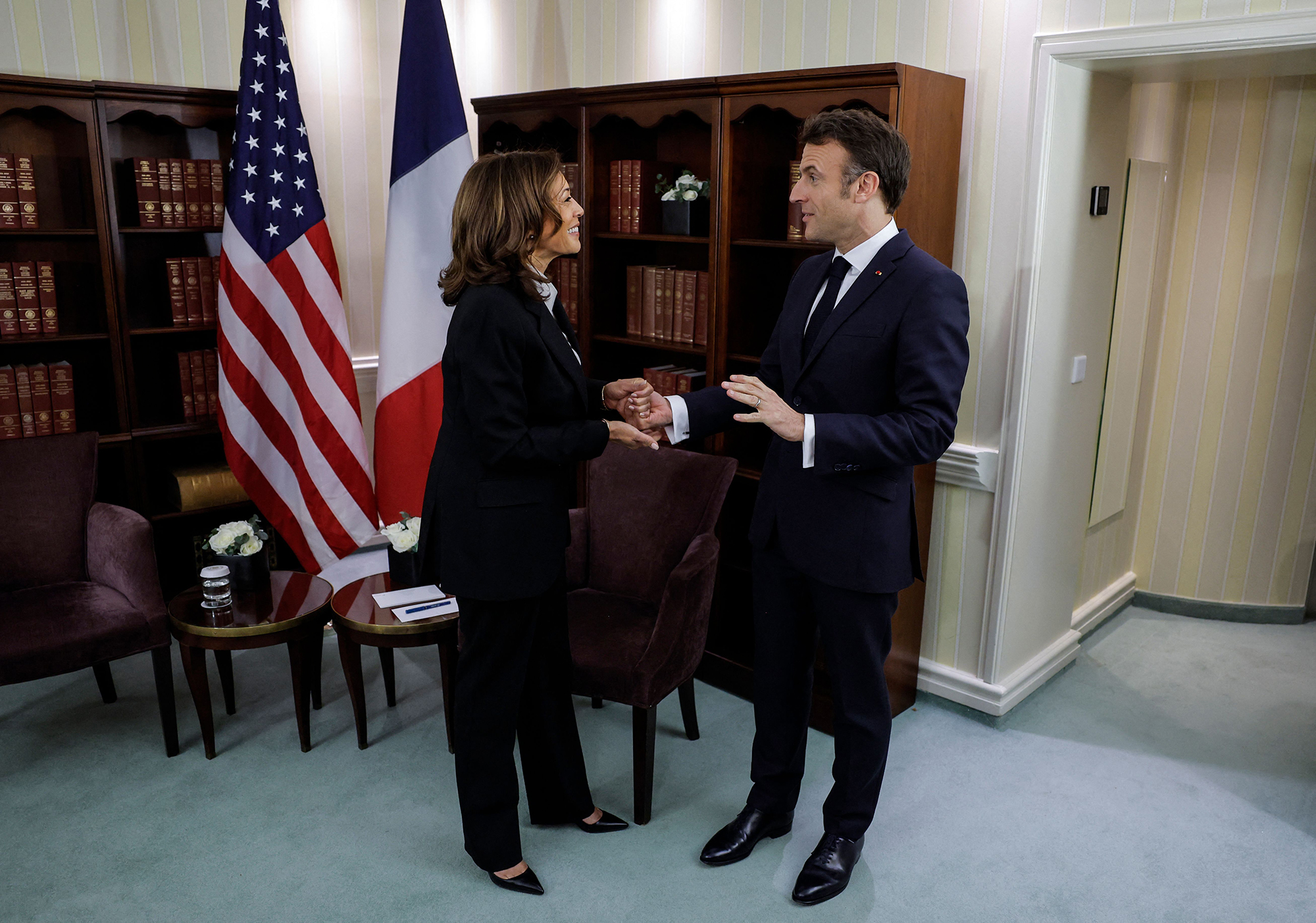 US Vice President Kamala Harris and French President Emmanuel Macron shake hands as they meet during the Munich Security Conference on February 17. 