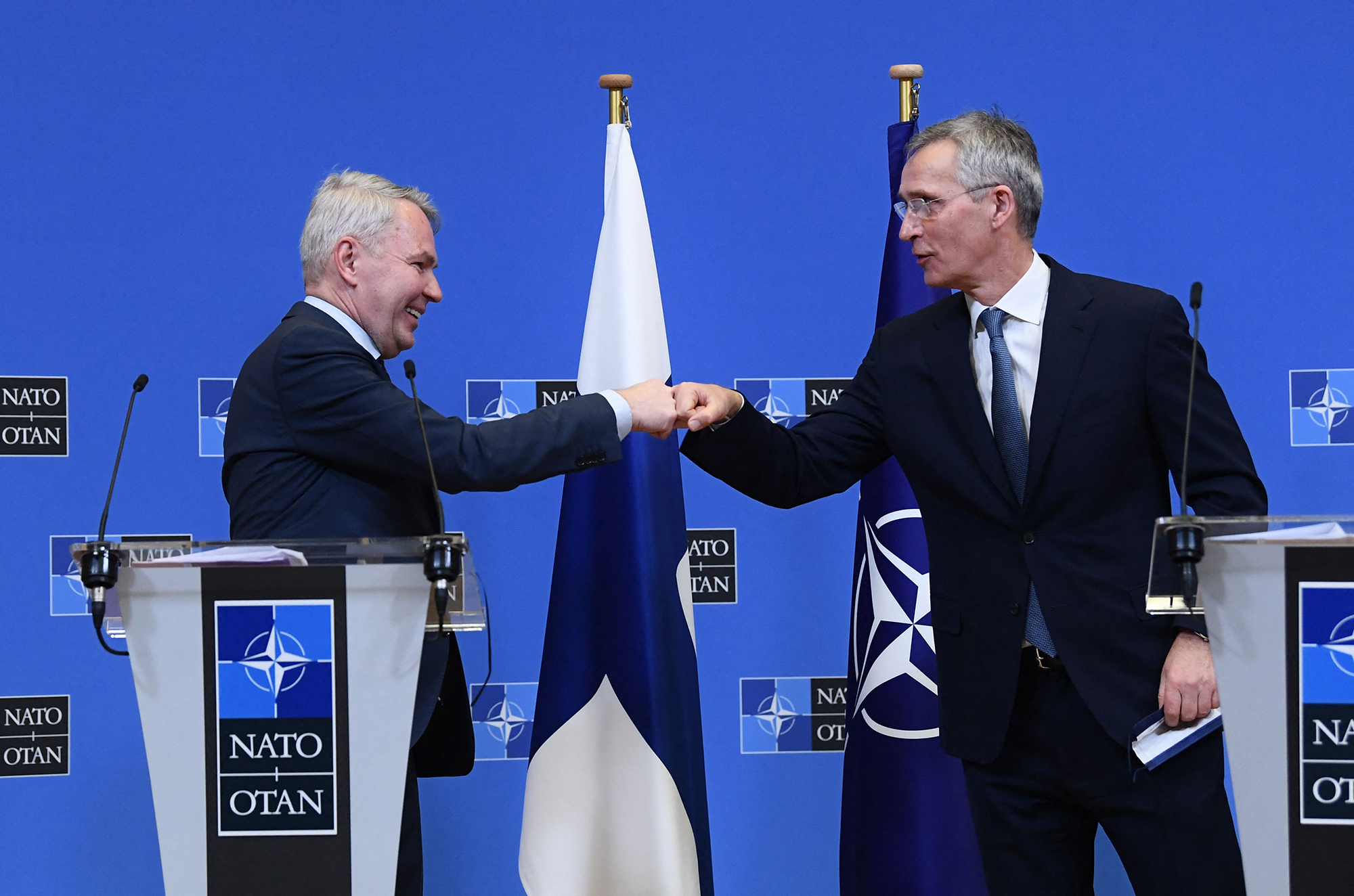 NATO Secretary General Jens Stoltenberg, right, and Finland Ministers for Foreign Affairs Pekka Haavisto bump fists after holding a joint press conference after their meeting at the Nato headquarters in Brussels, Belgium, on January 24, 2022.
