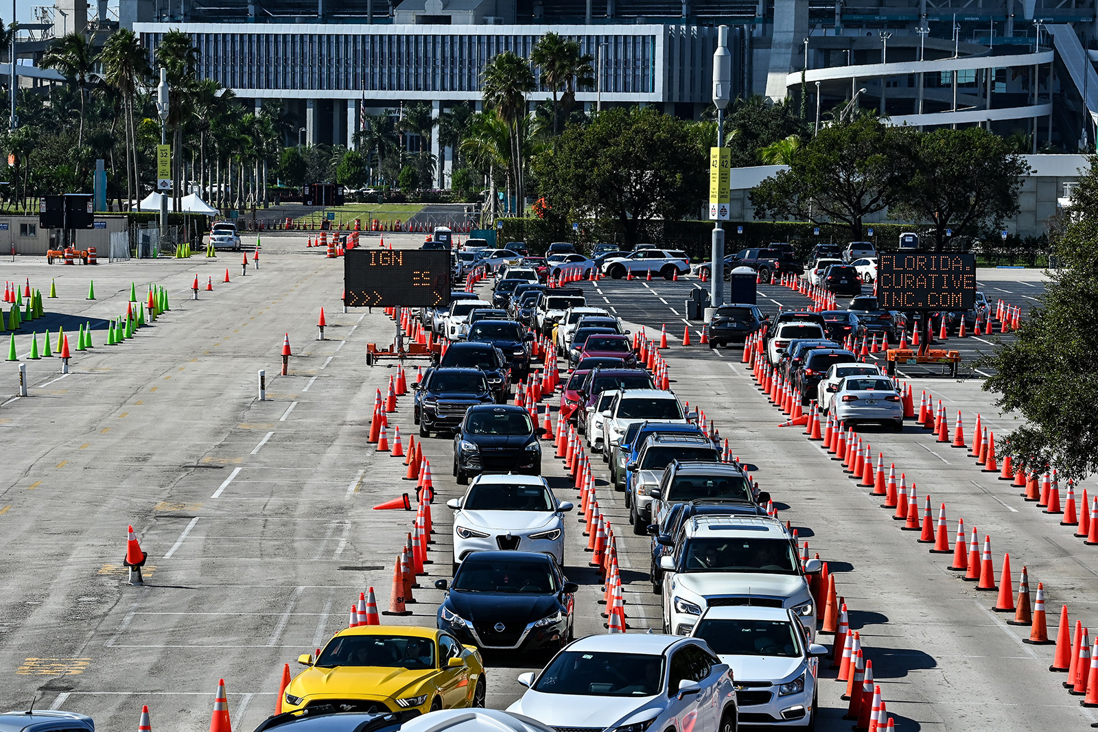 People wait inside vehicles at a drive-through Covid-19 testing site at Hard Rock Stadium in Miami, on December 10.