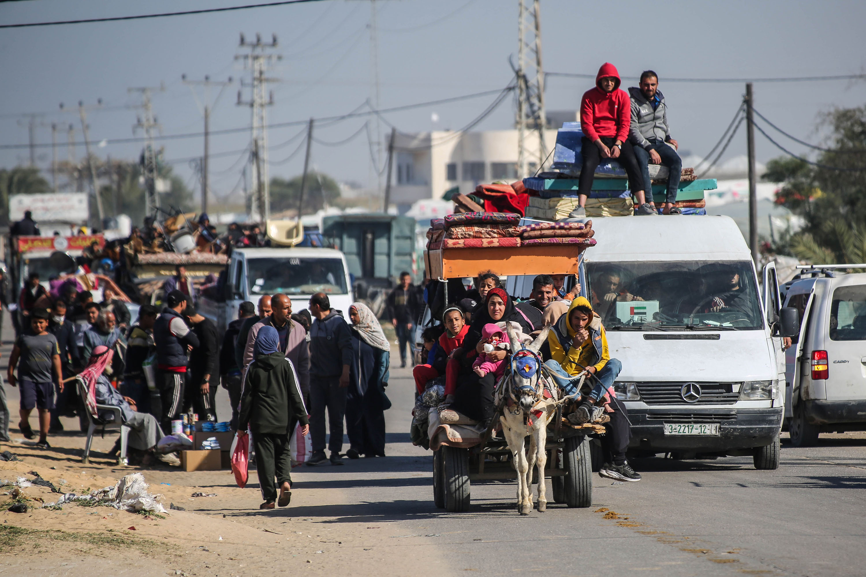 Palestinians displaced from Khan Younis travel with their belongings towards Rafah, in southern Gaza, on January 22. 