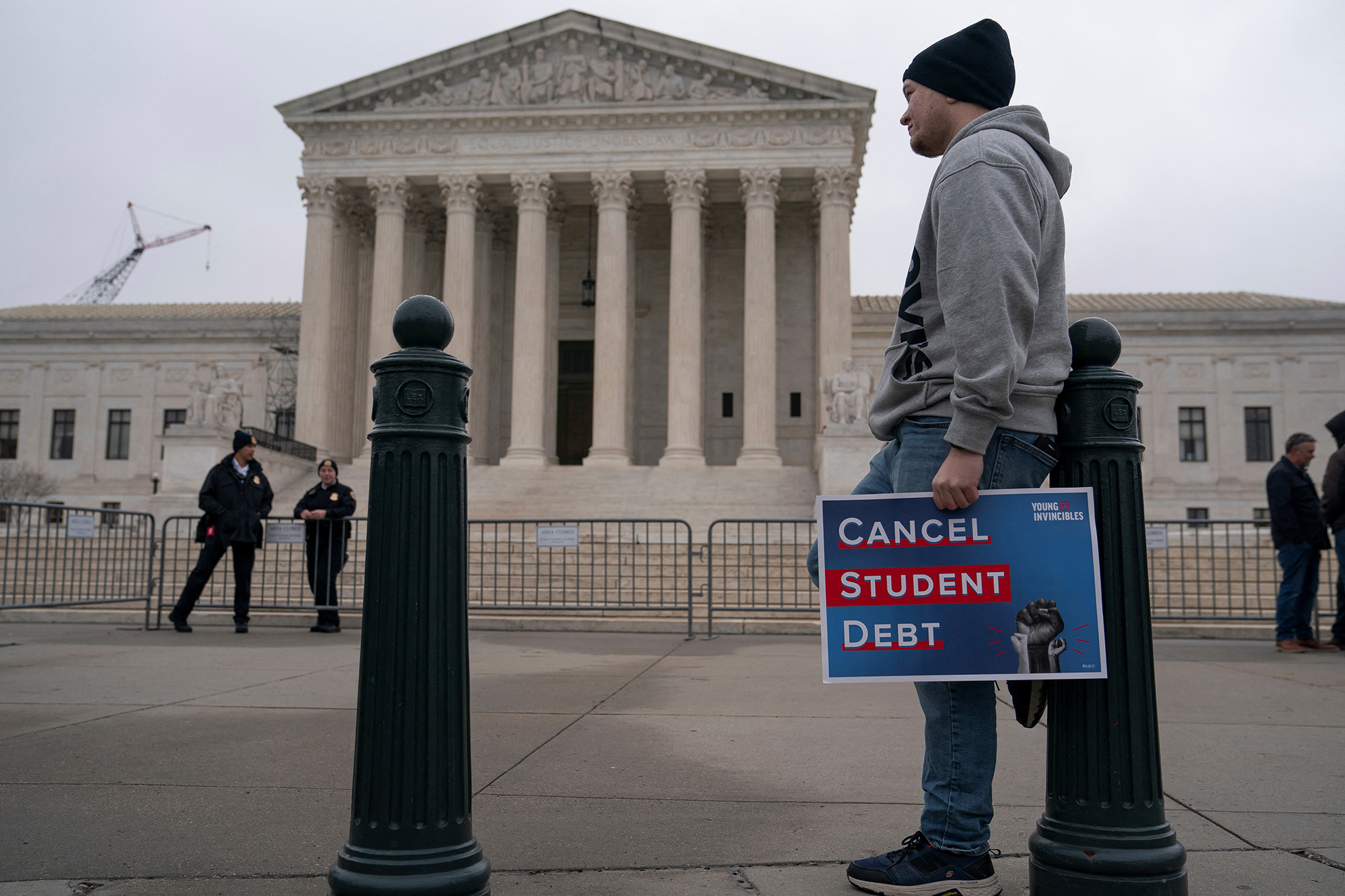 Jordan Crowe, a supporter of student loan debt relief, rallies in front of the Supreme Court as the justices are scheduled to hear oral arguments in two cases involving President Joe Biden's bid to reinstate his plan to cancel billions of dollars in student debt in Washington, DC, on February 28.