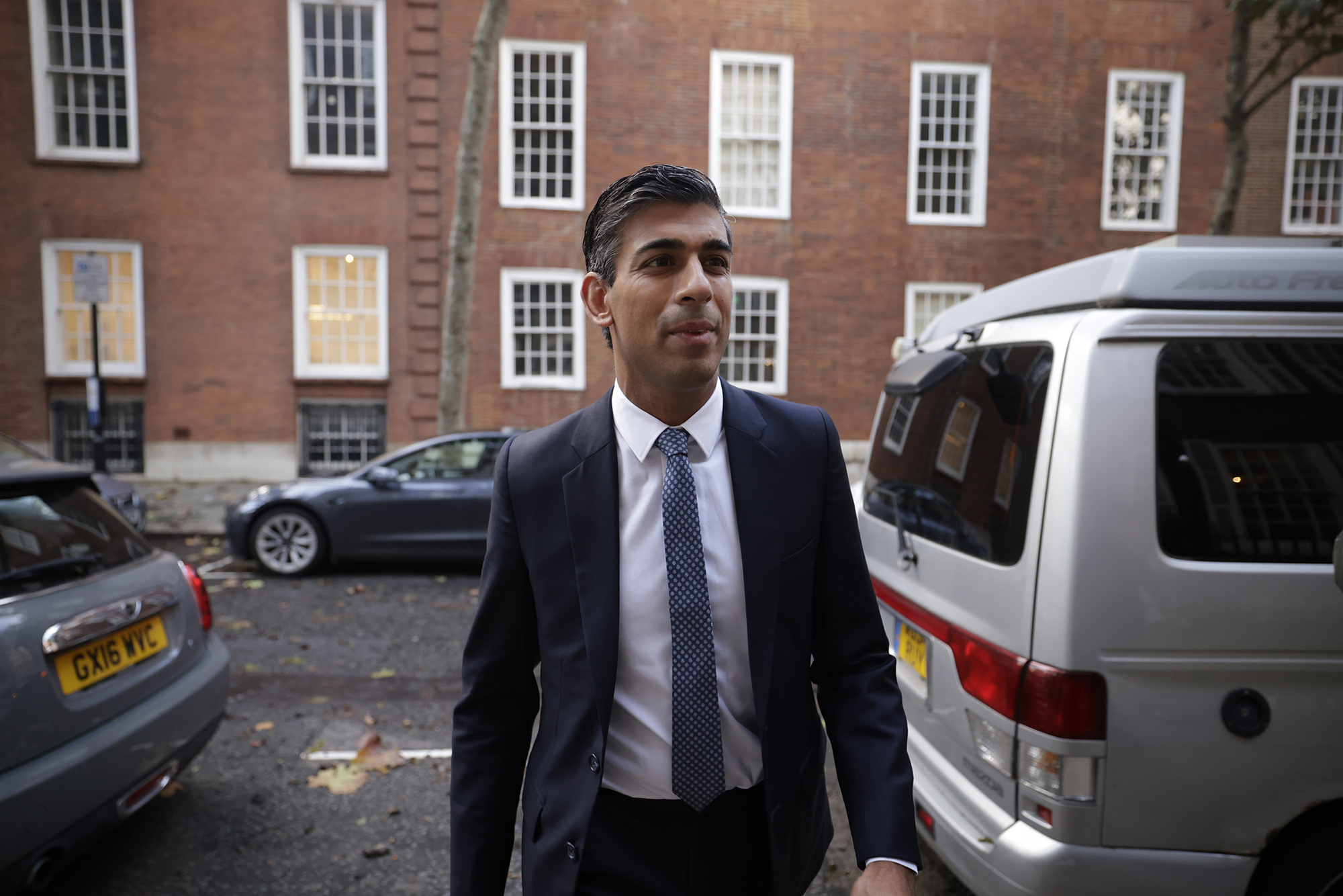 Britain's former Chancellor of the Exchequer Rishi Sunak arrives at his office in Millbank, in London on Monday.
