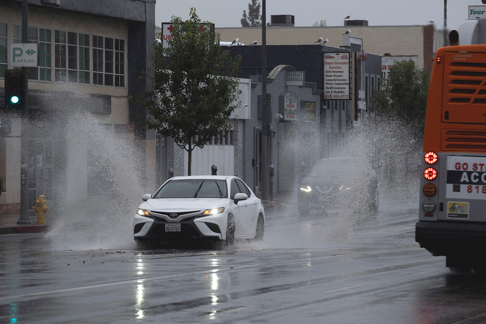 Motorists drive through the rain in Los, Angeles, California on Sunday. 