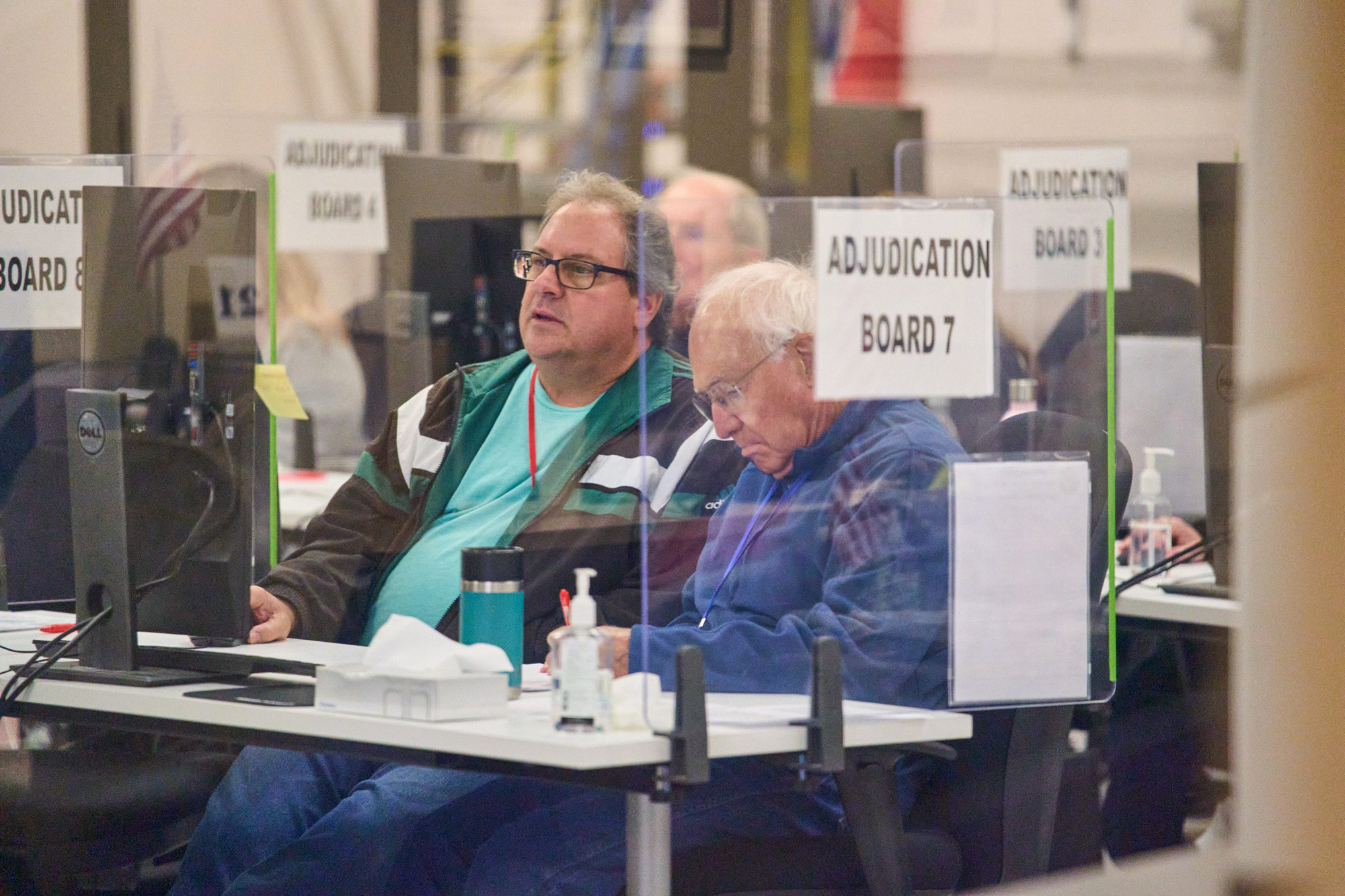 Tabulators process ballots at the Maricopa County Tabulation and Election Center in Phoenix, on Saturday.