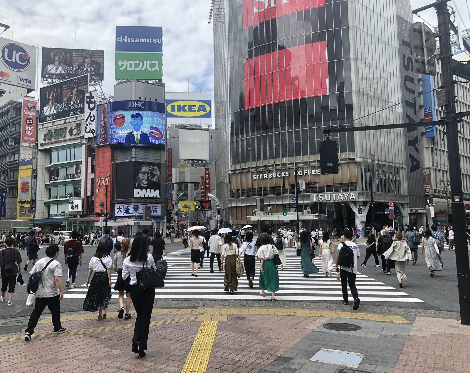 People cross an intersection in front of Shibuya Station amid the coronavirus outbreak in Tokyo, on September 10.