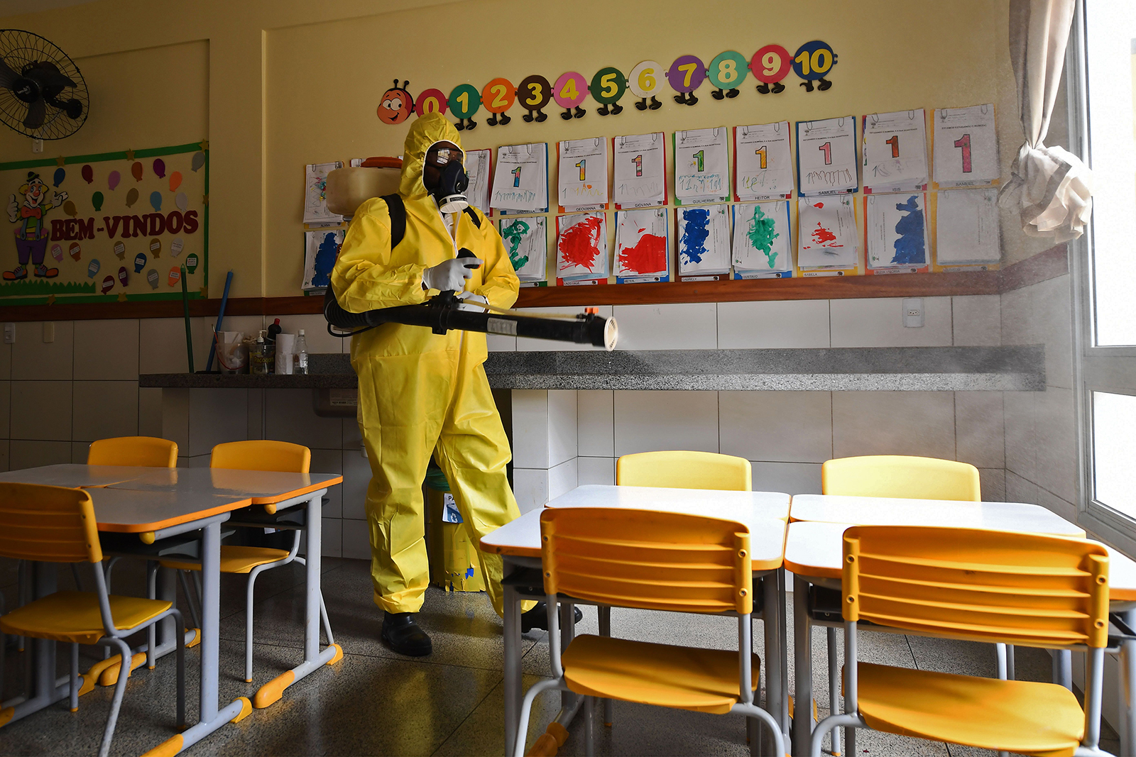 A Federal District's employee disinfects a public school in Brasilia, on August 5,.